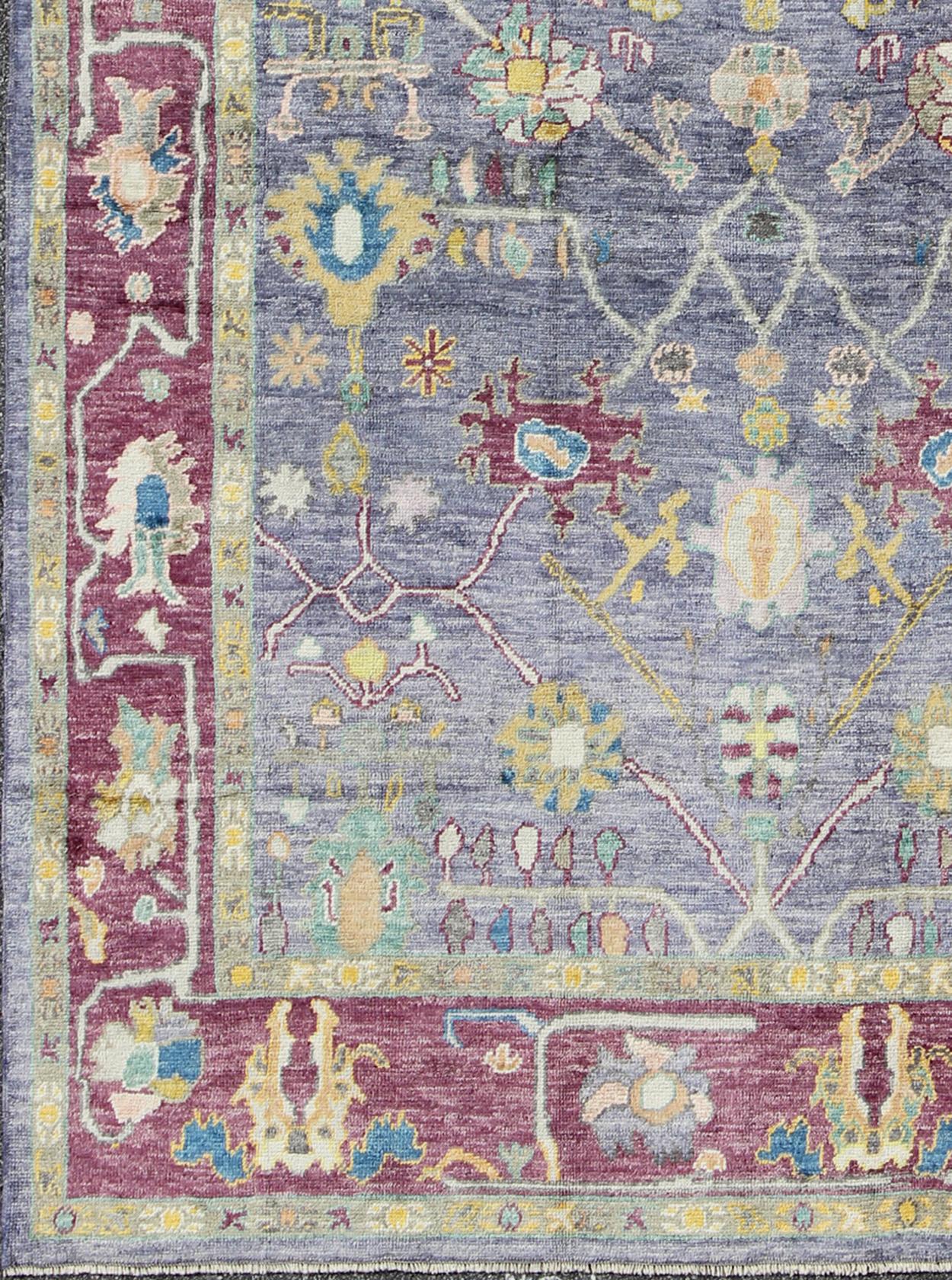 Turkish Oushak rug with colorful palette and all-over flower design, Keivan Woven Arts rug en-165631, country of origin / type: Turkey / Oushak.

This traditional Oushak rug from Turkey features a unique color palette and an all-over design of