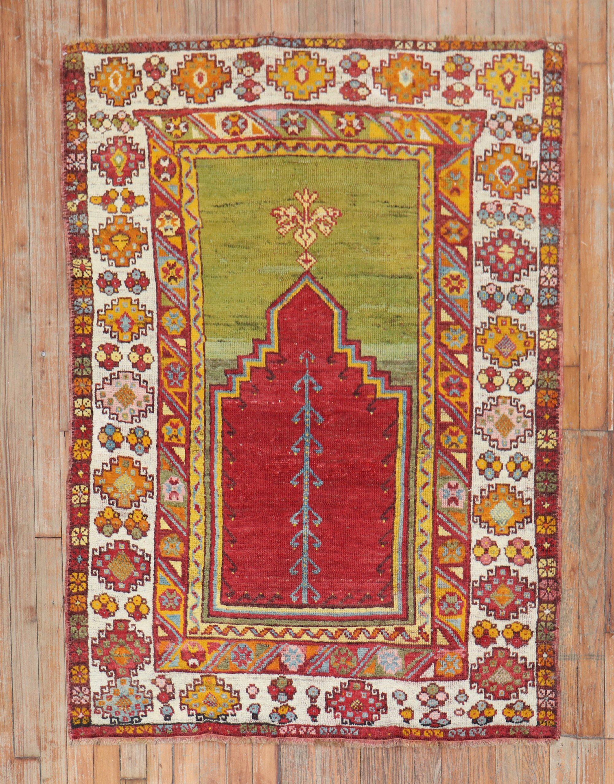 Mid 20th century colorful Turkish Melas rug in bright colors highlighted by a mihrab prayer niche design

Measures: 3'6