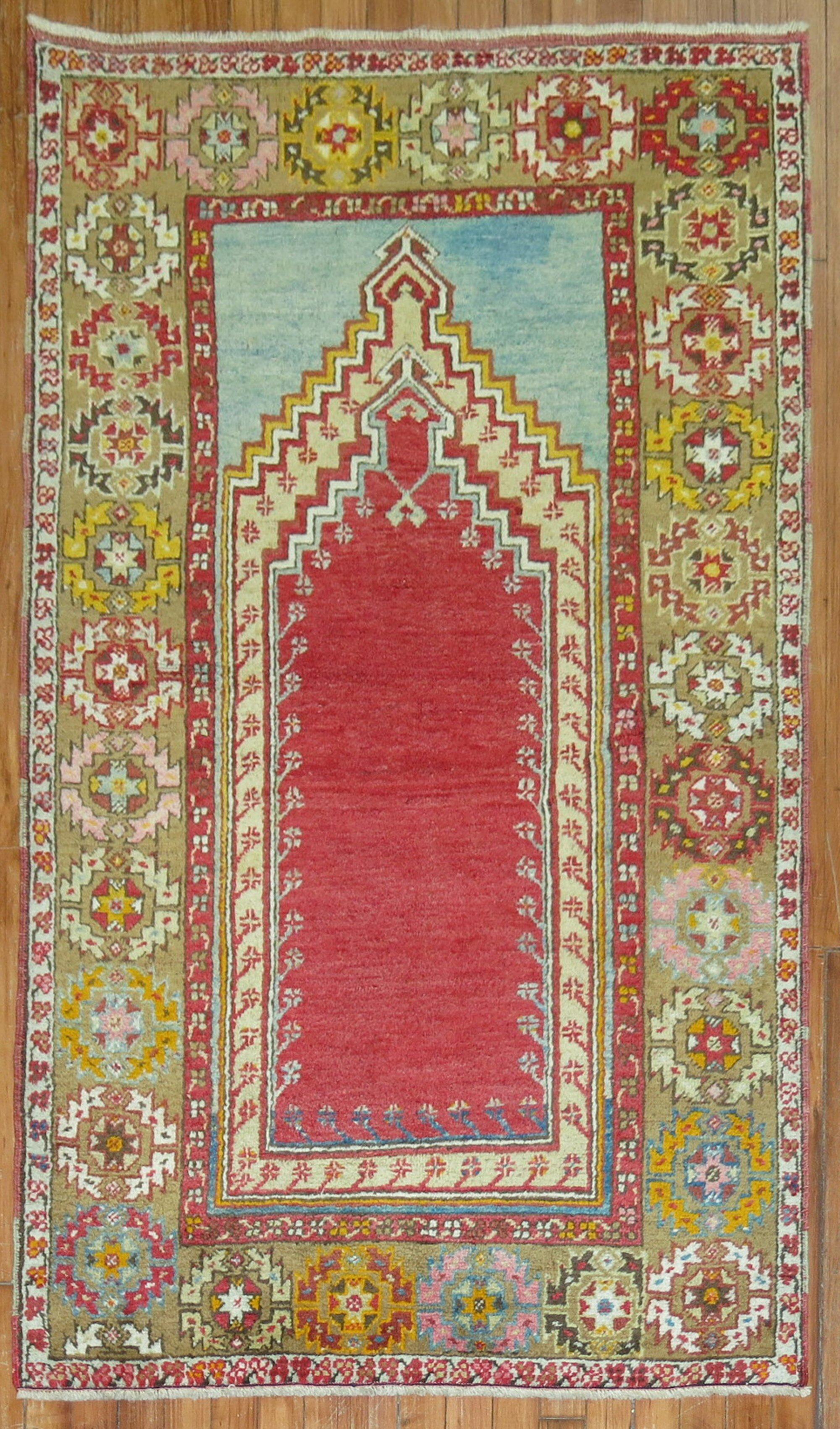Mid 20th century colorful Turkish Melas rug in bright colors highlighted by a mihrab prayer niche design

Measures: 3'3