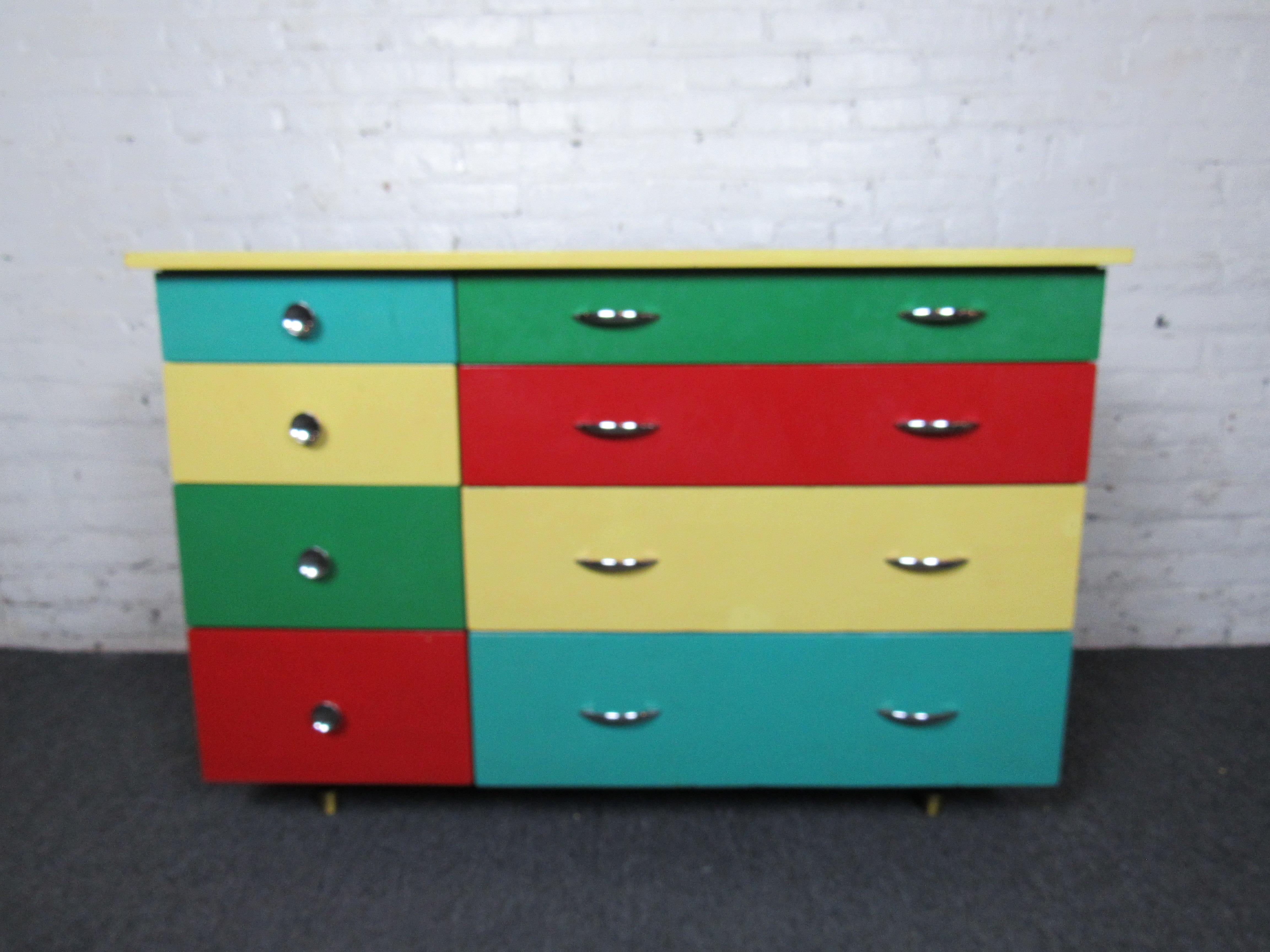 A fun and colorful vintage dresser that is sure to brighten its surroundings. Metal handles complement the dresser's vibrant colors and make this vintage piece truly unique. Please confirm item location with seller (NY/NJ).