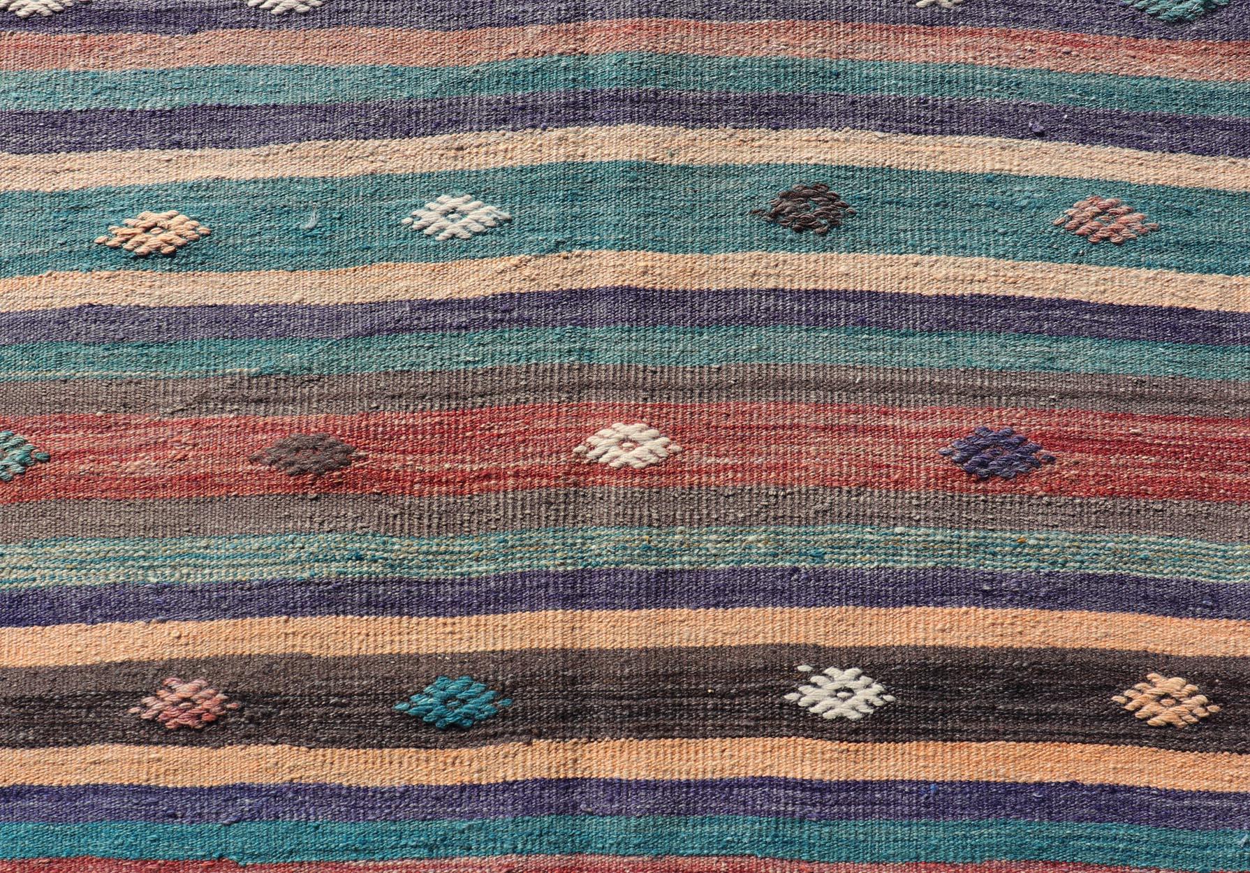 Measures: 3'3 x 10'10 
Colorful Vintage Embroidered Kilim Runner with Stripe's and Geometric. Keivan Woven Arts / rug TU-NED-5004, country of origin / type: Turkey / Kilim, circa 1950

This vintage Kilim displays an array of designs, including a