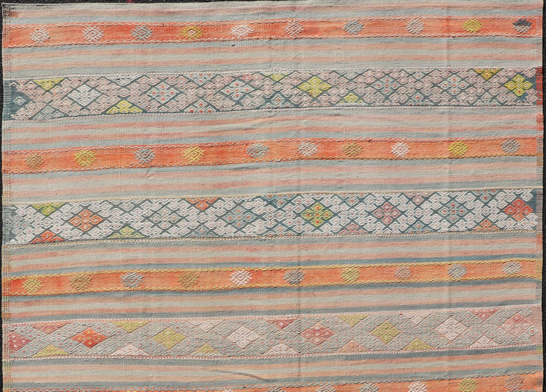Colorful Vintage Turkish Embroidered Kilim With Stripe's and Geometric Motifs.  Geometric stripe design Kilim rug in multi-colors, Keivan Woven Arts / rug EN-179941, country of origin / type: Turkey / Kilim, circa 1950

This vintage Kilim displays
