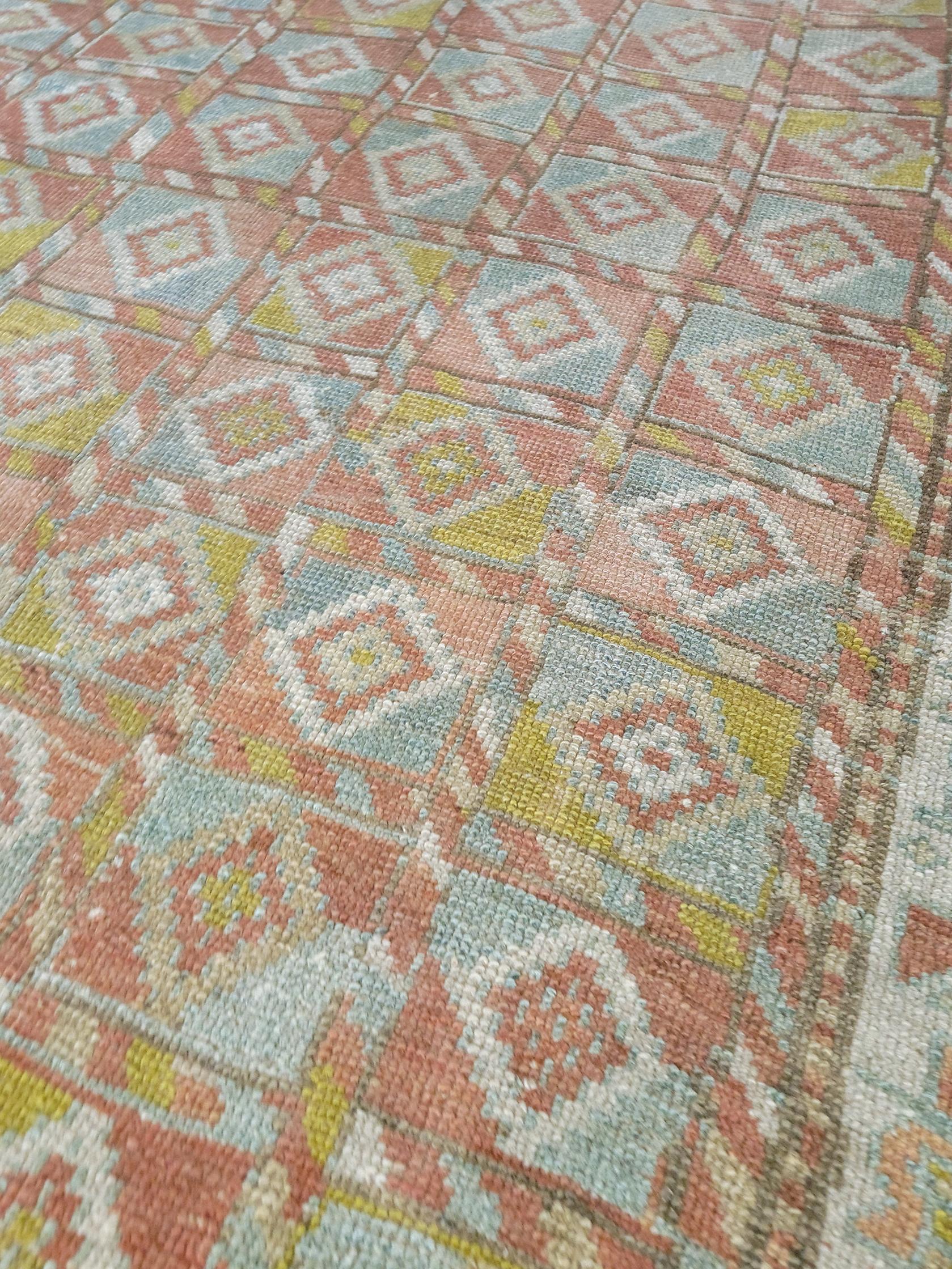 Age: Circa 1940

Colors: pink, blue, yellow

Pile: Low.

Material: Wool.

Wear Notes: 2 

Fun and colorful vintage Kurdish rug with an interesting geometric design. Soft underfoot, good condition with even fading.

Wear Guide:
Vintage