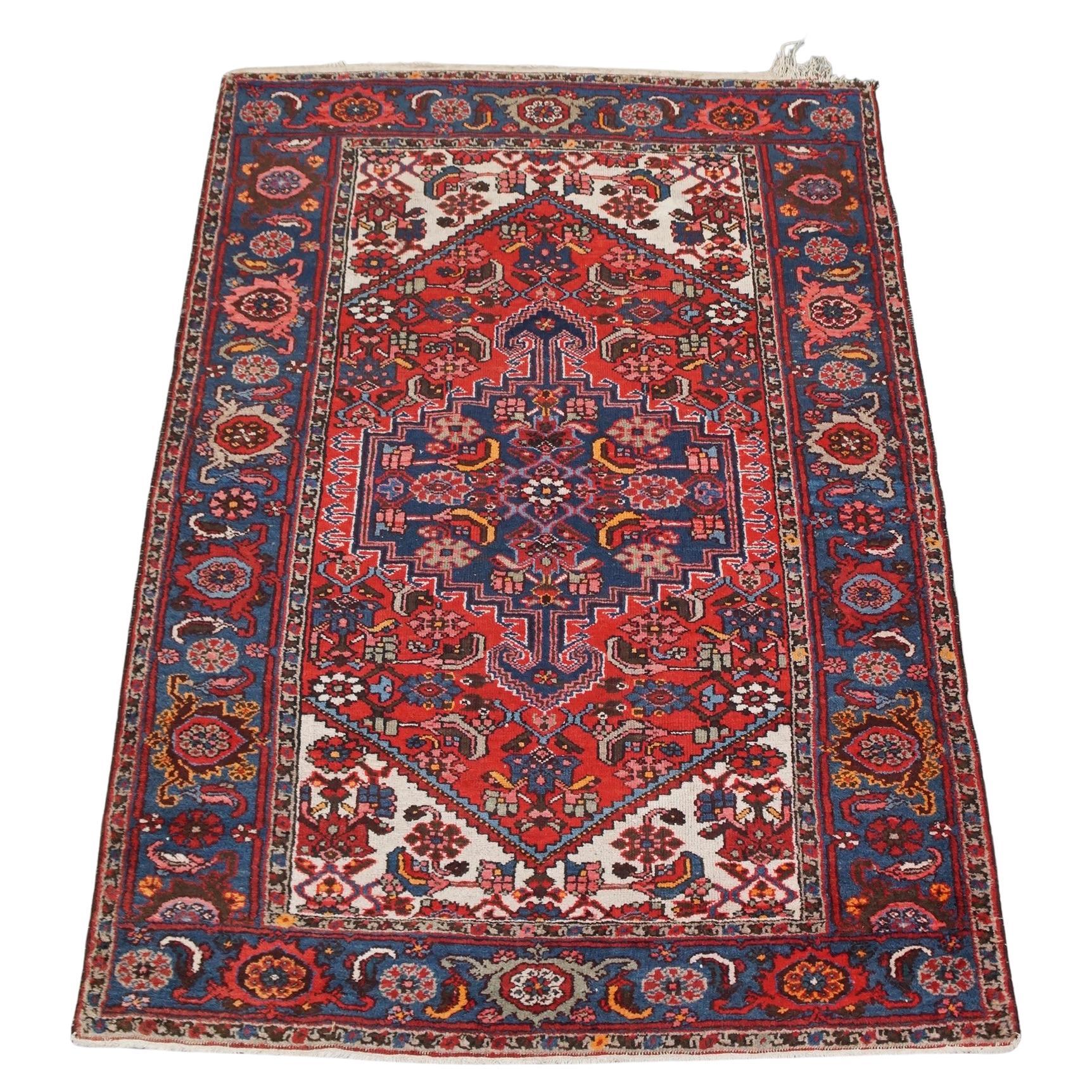 Colorful vintage oriental hand-knotted rug with beautiful patterns 201x139cm