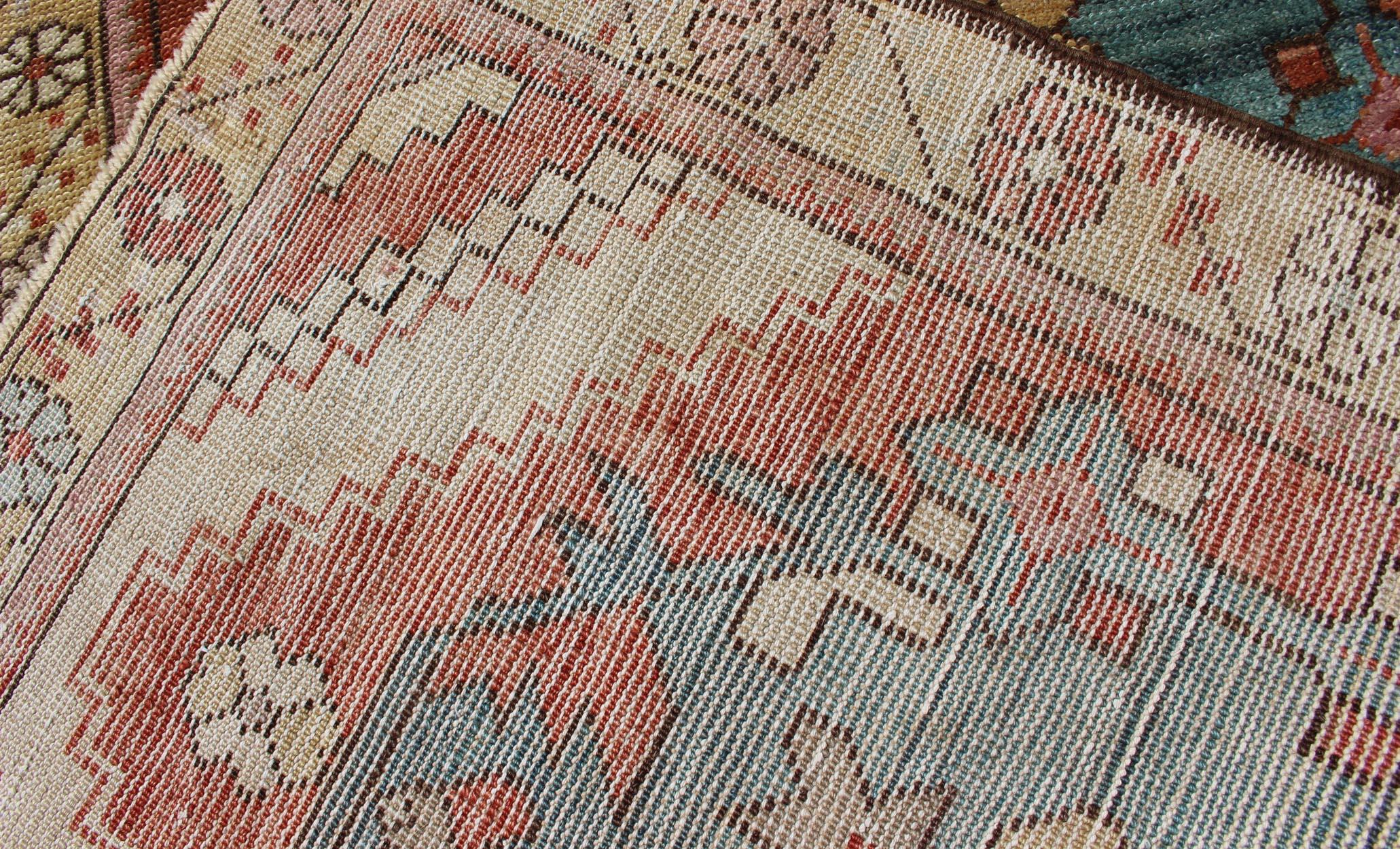 teal and terracotta rug