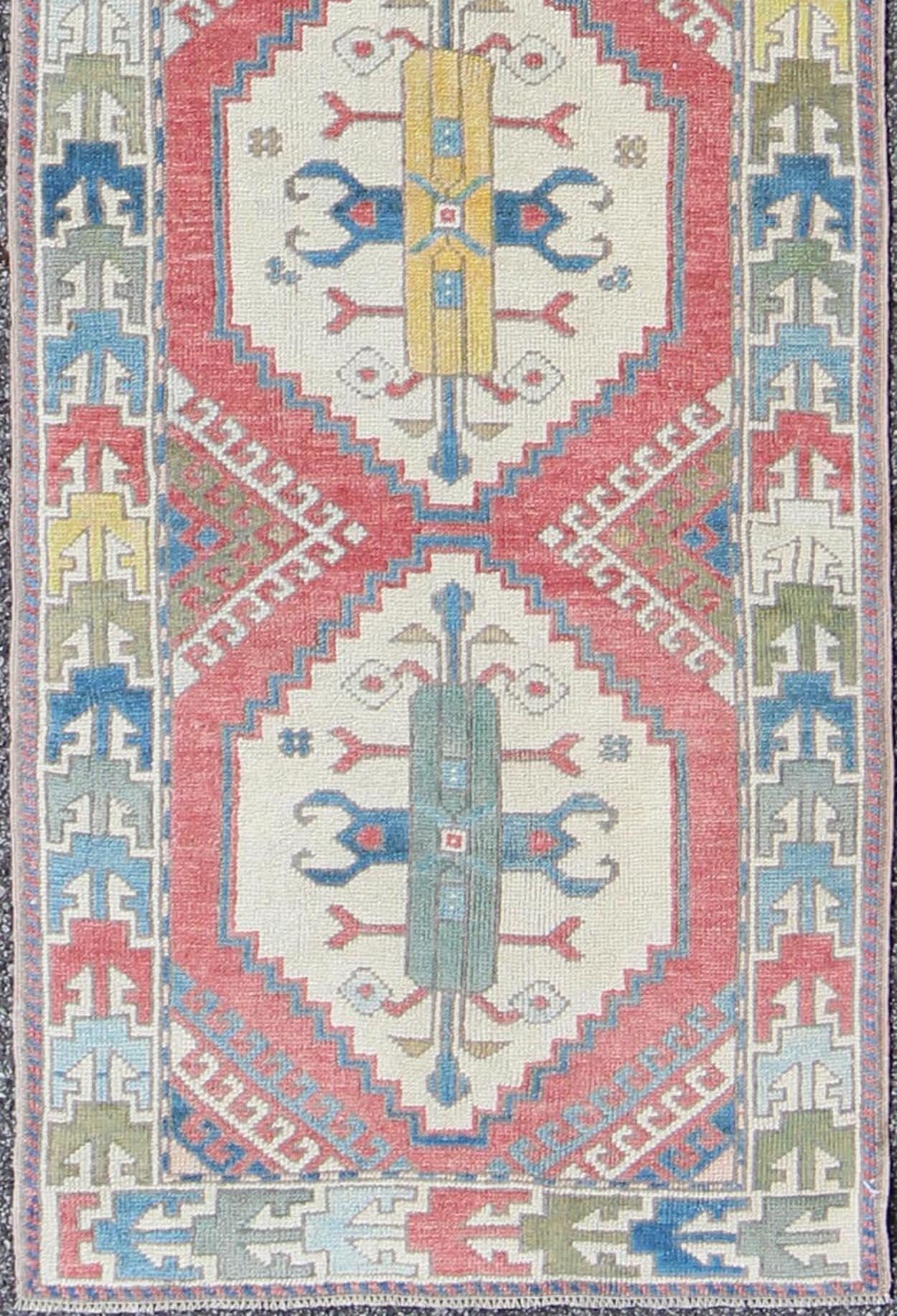 Hand-Knotted Colorful Vintage Oushak Turkish Narrow Runner with Geometric Design For Sale