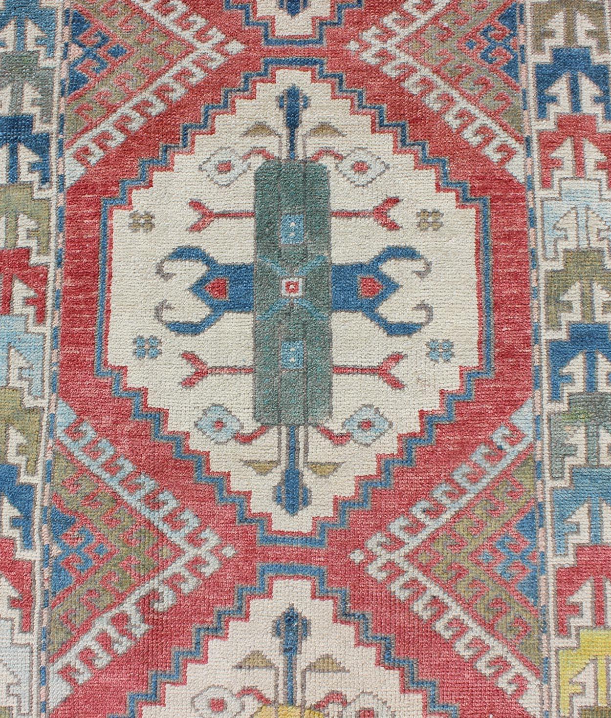 Wool Colorful Vintage Oushak Turkish Narrow Runner with Geometric Design For Sale