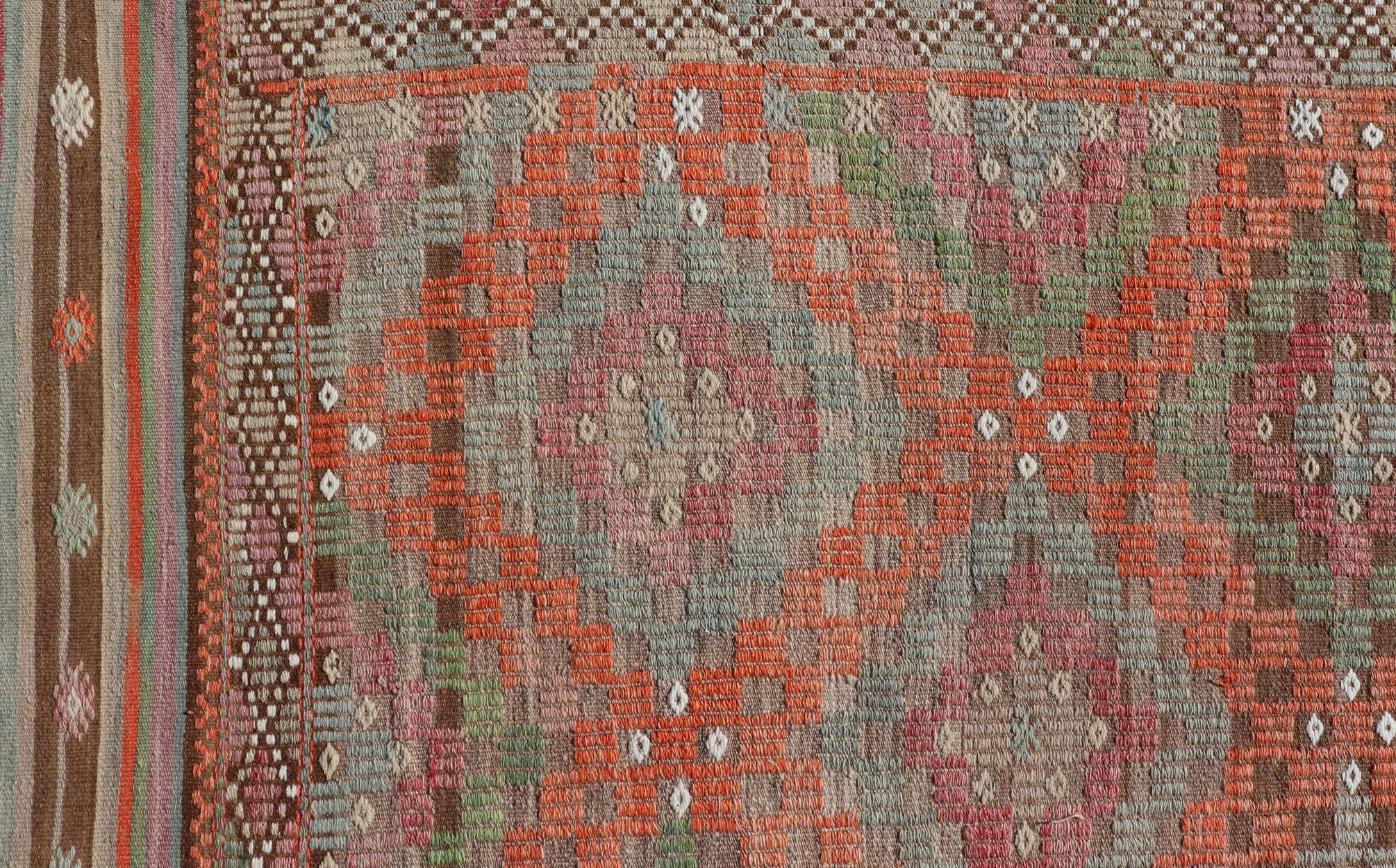 Vintage Turkish flat-weave Tribal Modern kilim with embroideries in multi colors, Keivan Woven Arts / rug / EN-178975 country of origin / type: Turkey / Kilim, circa 1950

Measures: 6'5 x 8'8.