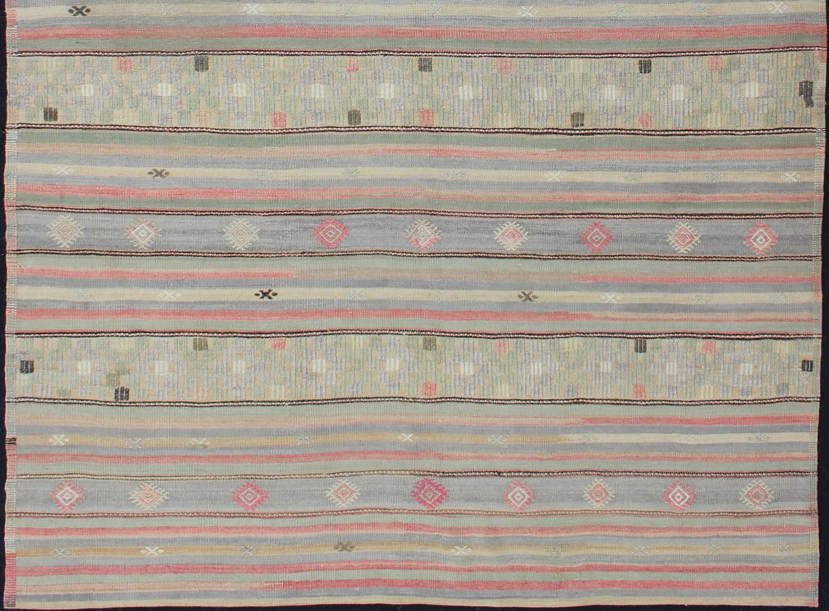 Horizontal stripe design flat-weave Kilim from Turkey vintage in pink, light blue, brown, and cream, rug EN-176549, country of origin / type: Turkey / Kilim, circa 1950.

Woven during the mid-20th century in Turkey, this fairly large vintage