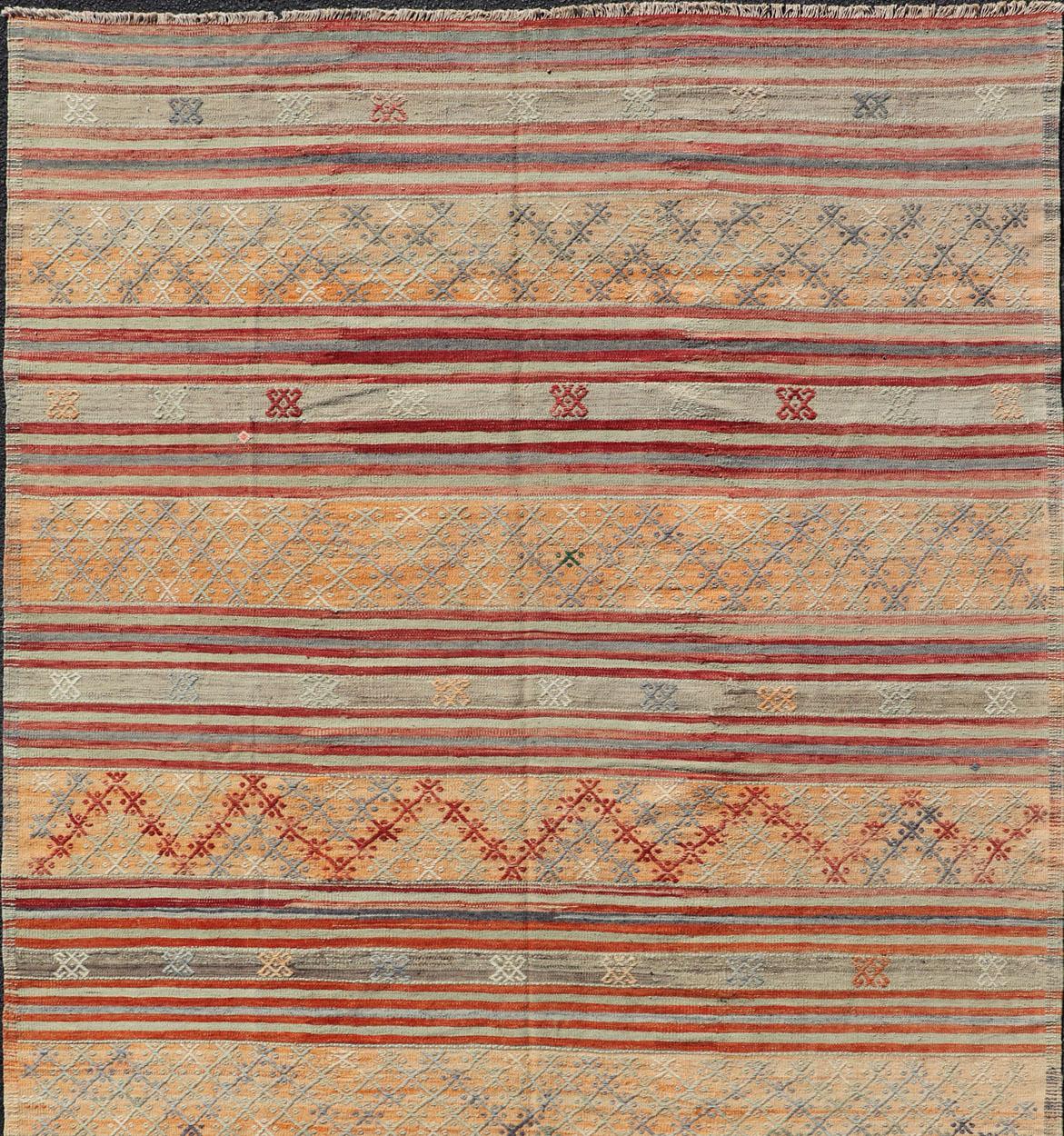 Colorful Vintage Turkish Embroidered Kilim with Stripes and Geometric Motifs.
Geometric stripe design Kilim runner in multi-colors and softer tones, Keivan Woven Arts/ rug / TU-NED-1039, country of origin / type: Turkey / Kilim, circa