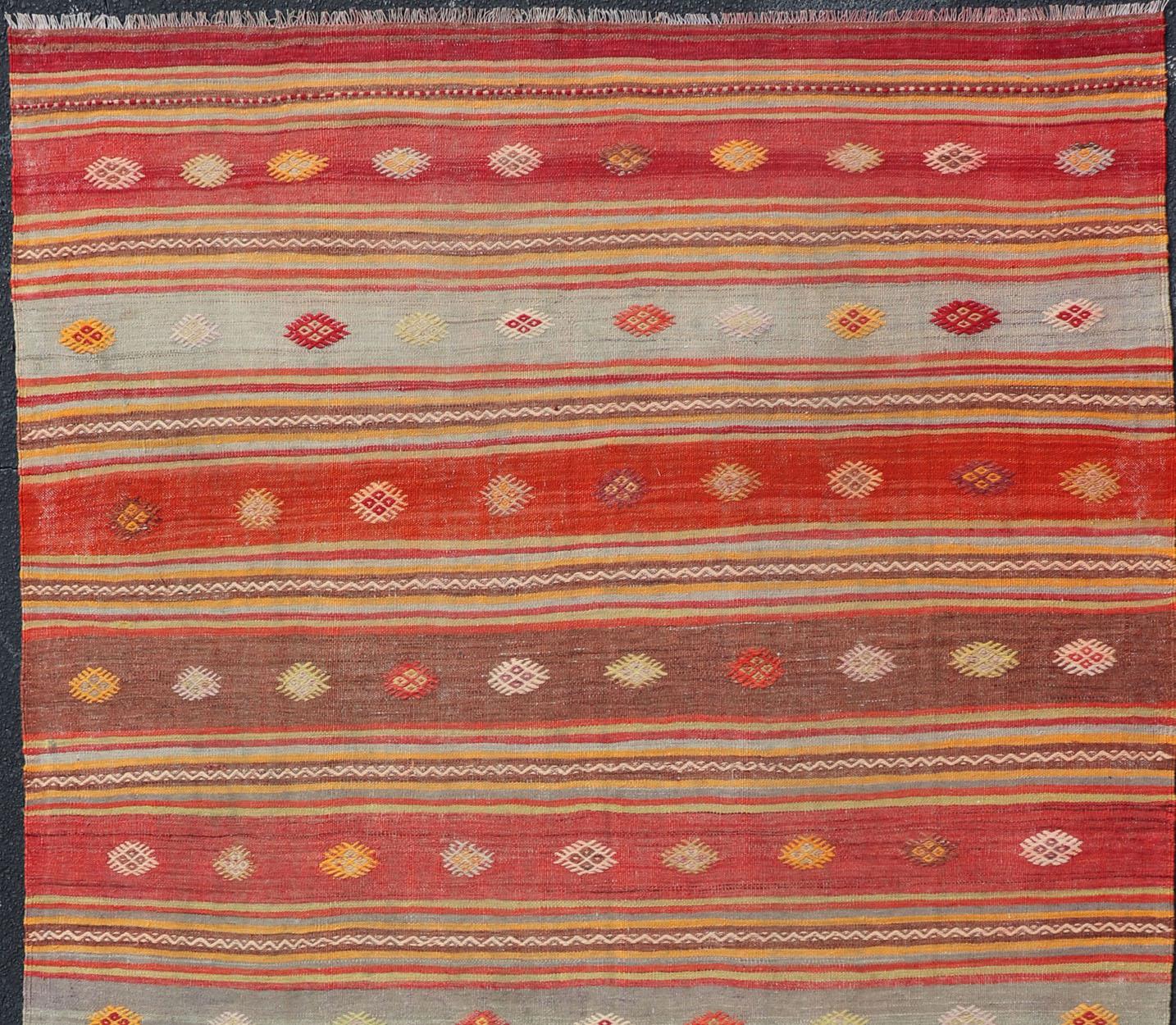 Colorful Vintage Turkish Embroidered Kilim with Stripes and Geometric Motifs. Keivan Woven Arts / rug EN-178880, country of origin / type: Turkey / Kilim, circa 1940

This vintage Turkish flat-woven Kilim features a minimalist design rendered in