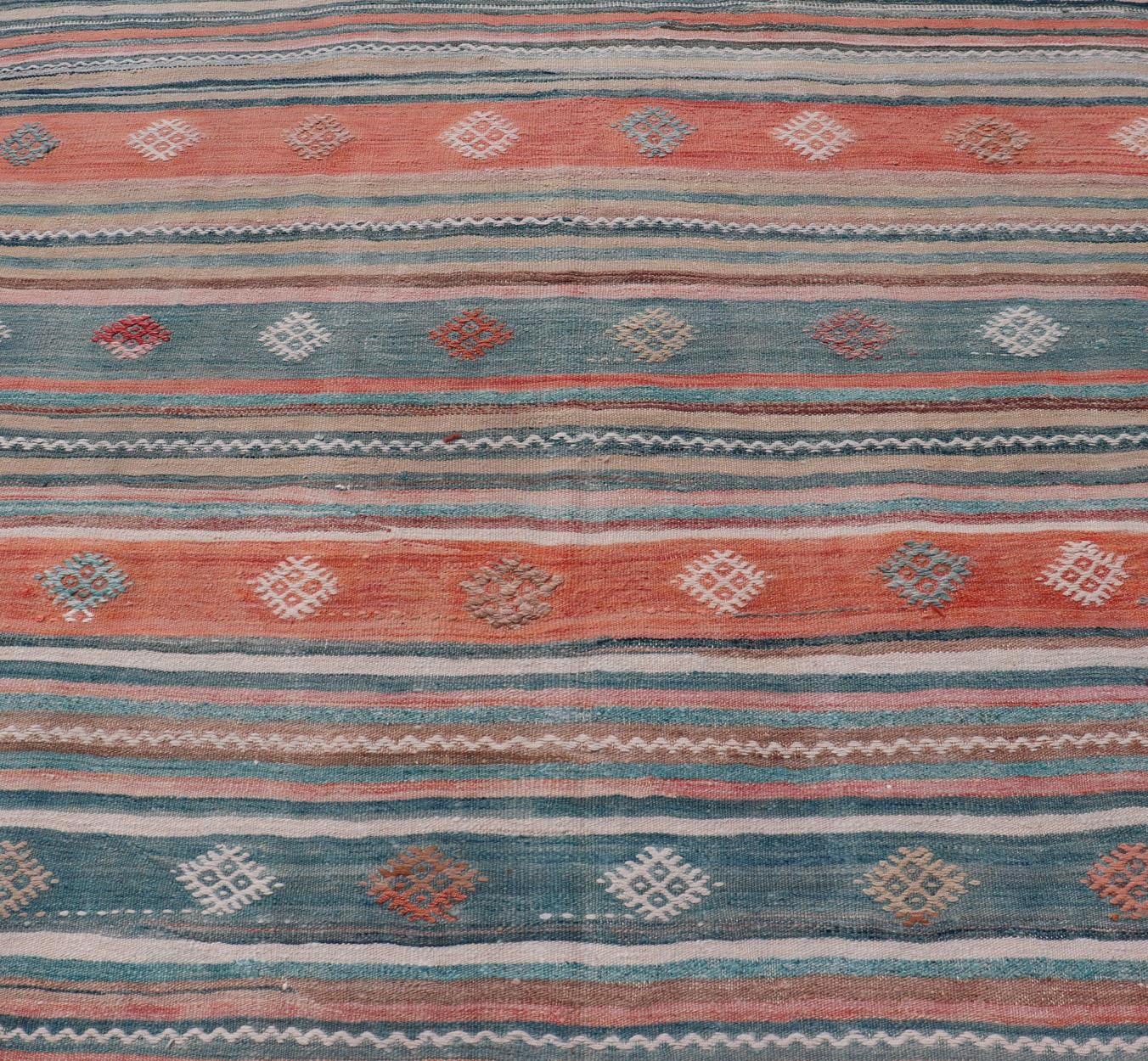 Colorful Vintage Turkish Embroidered Kilim with Stripes and Geometric Motifs. Keivan Woven Arts / rug EN-179945, country of origin / type: Turkey / Kilim, circa 1950
Measures: 5'5 x 10'4 
This vintage Turkish flat-woven Kilim features a minimalist