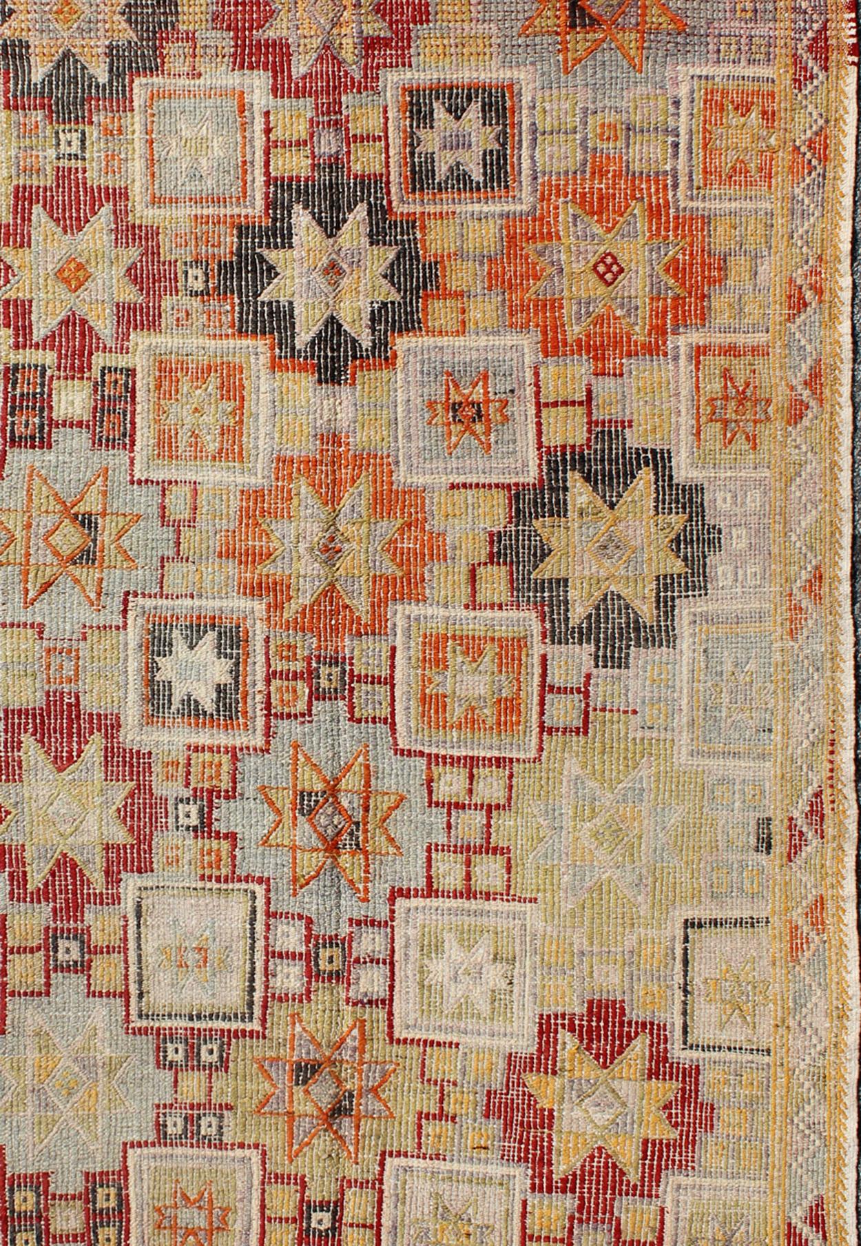 Vintage Turkish flat-weave Tribal Modern kilim with embroideries in multi colors, rug / TU-NED-4716. 

Measures: 5 x 9'9 

Rendered in star shapes with a spotted and speckled assortment of geometric elements, this unique midcentury Turkish Kilim