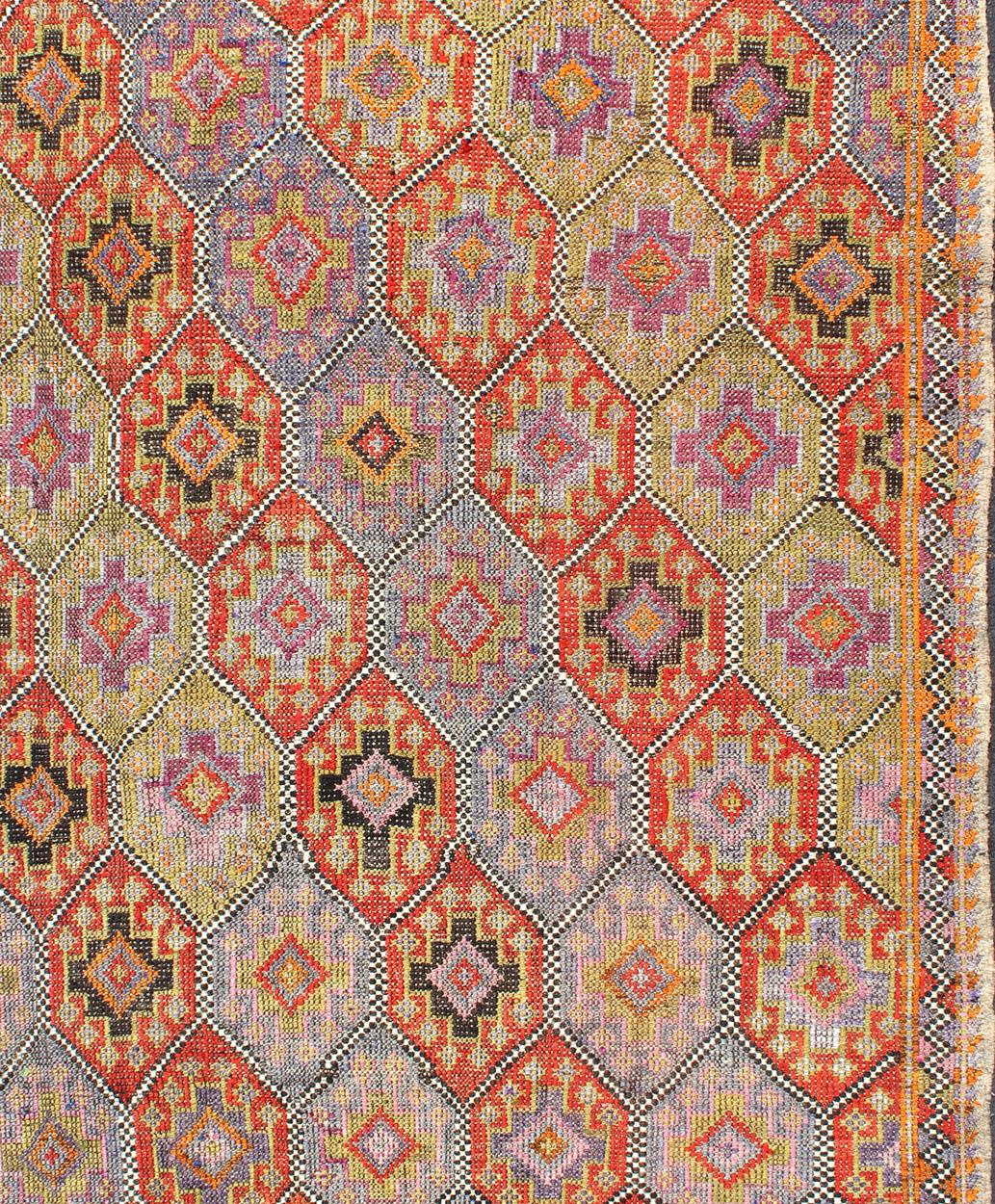  Vintage Turkish flat-weave with Tribal and Modern design with embroideries in multi colors, rug / TU-NED-551 Mid-20th Century Turkish Kilim

Measures: 5'7 x 8'11

 Rendered in diamond shapes with a spotted and speckled assortment of geometric