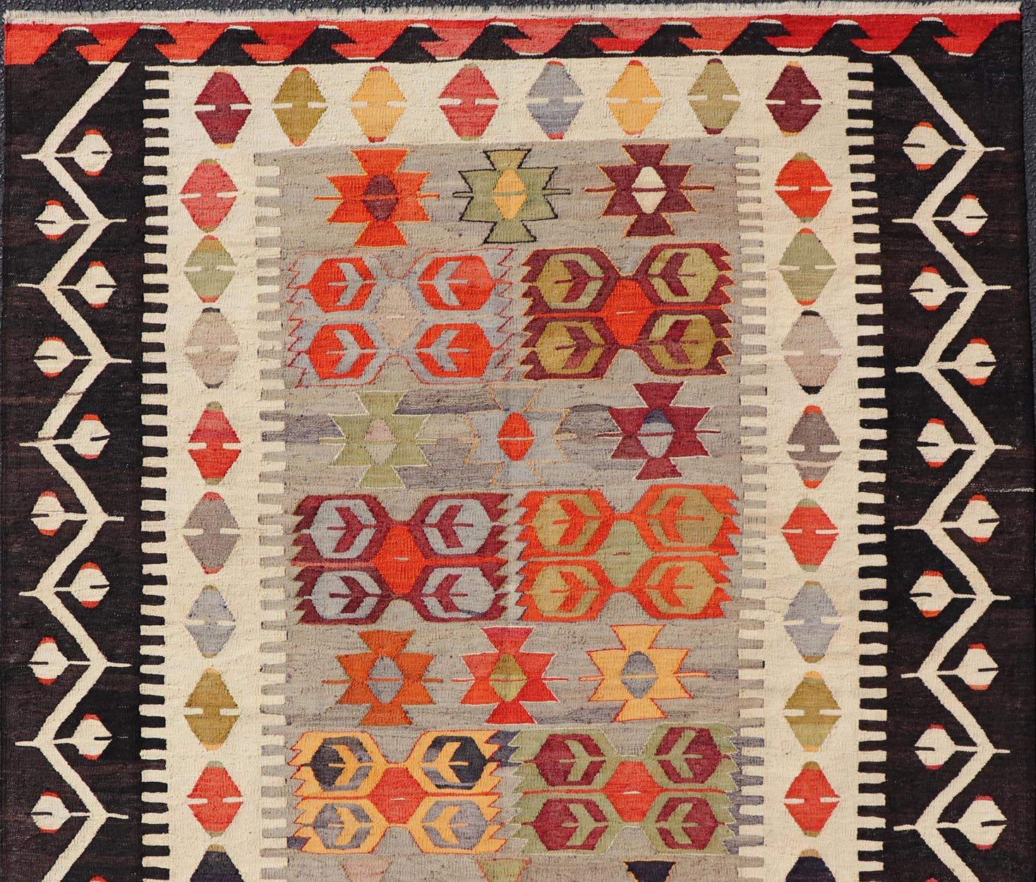 Hand-Woven Colorful Vintage Turkish Flatweave Rug with All-Over Tribal Design For Sale