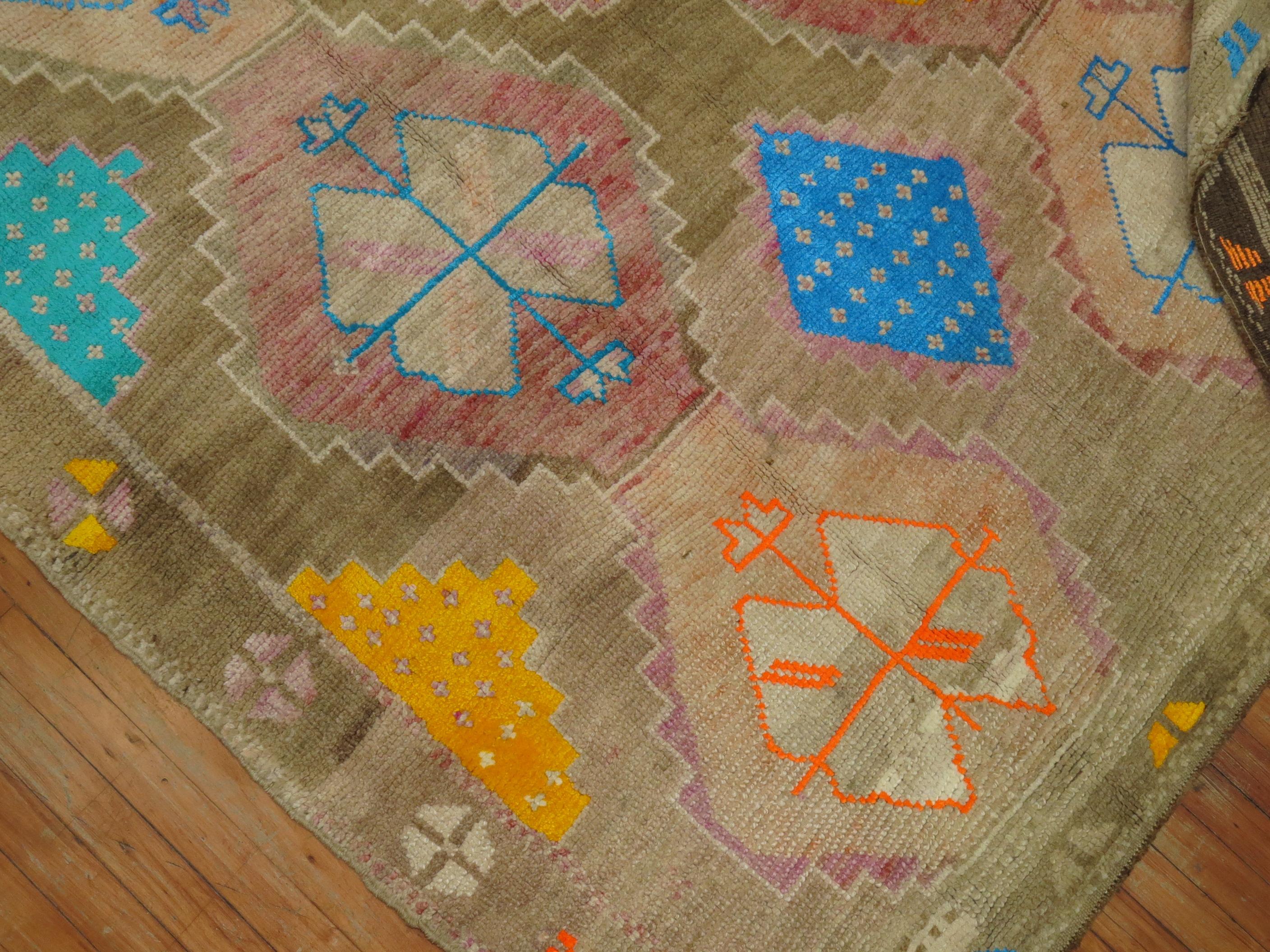 Awesome looking mid-20th century Kars with colorful geometric medallions on a brown abrashed ground. This is as unique of a rug that you will ever see. If you want me make a statement in a space then go for it!