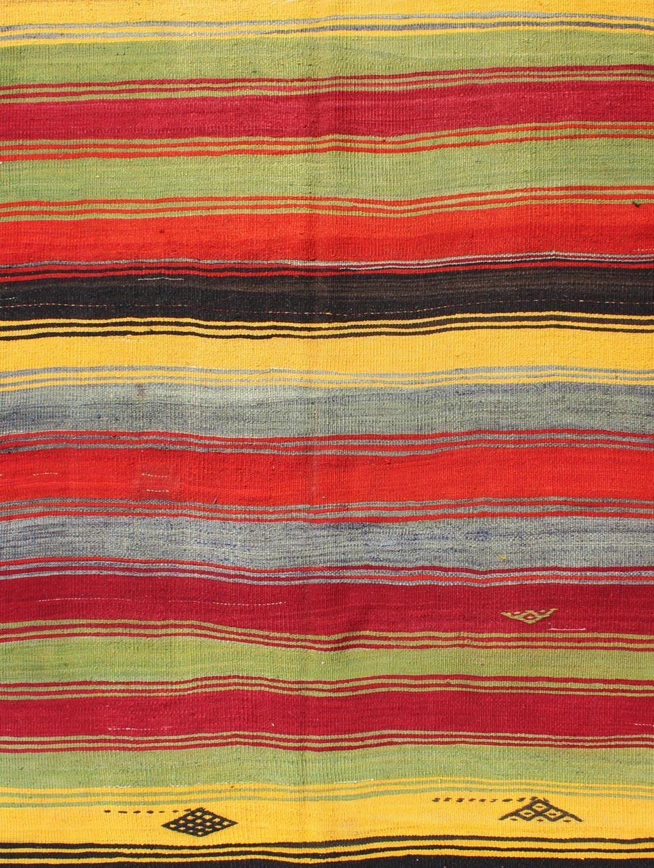 Hand-Woven Colorful Vintage Turkish Kilim Rug with Subtle Tribal Shapes and Stripes Design For Sale