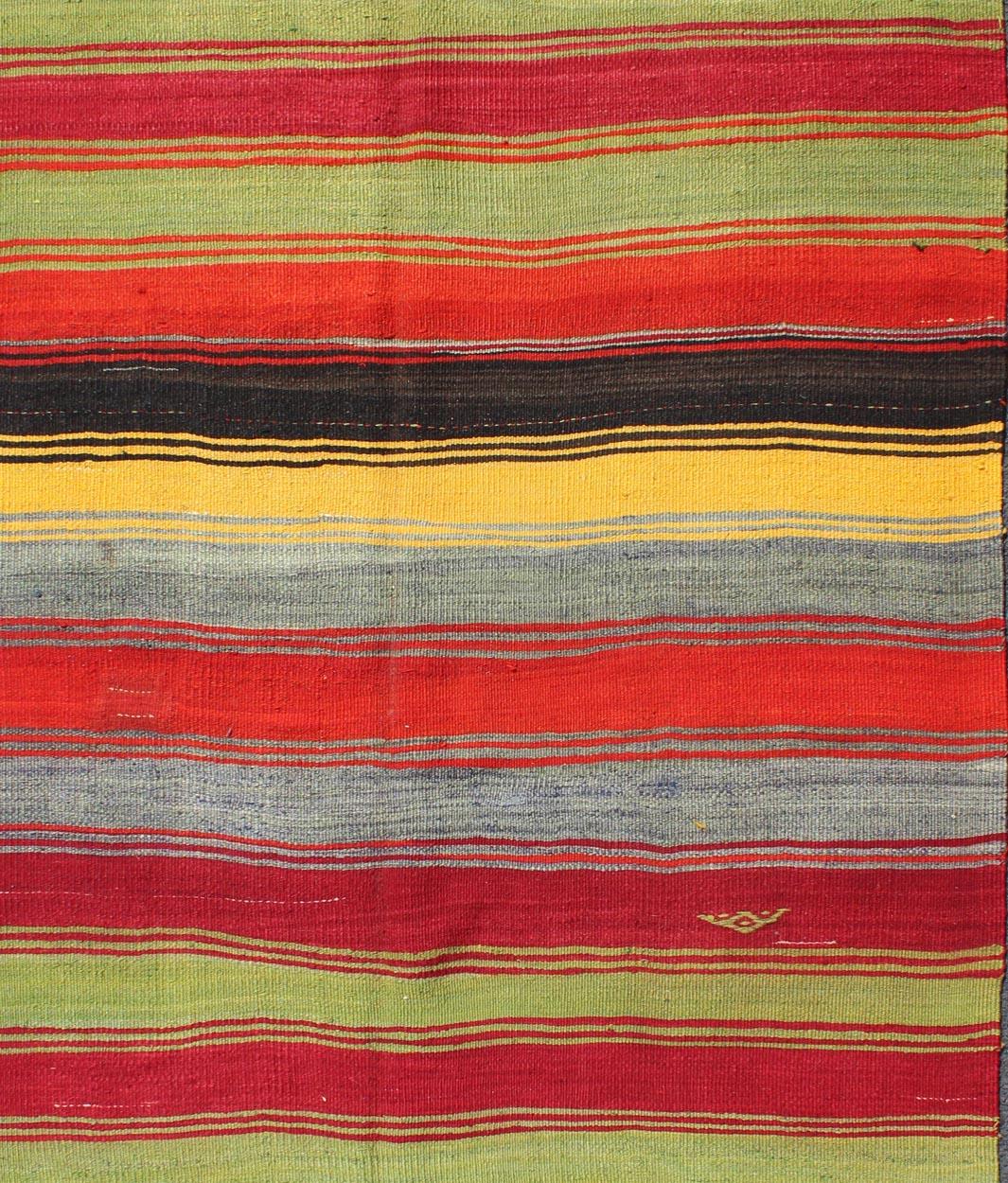 Colorful Vintage Turkish Kilim Rug with Subtle Tribal Shapes and Stripes Design In Excellent Condition For Sale In Atlanta, GA