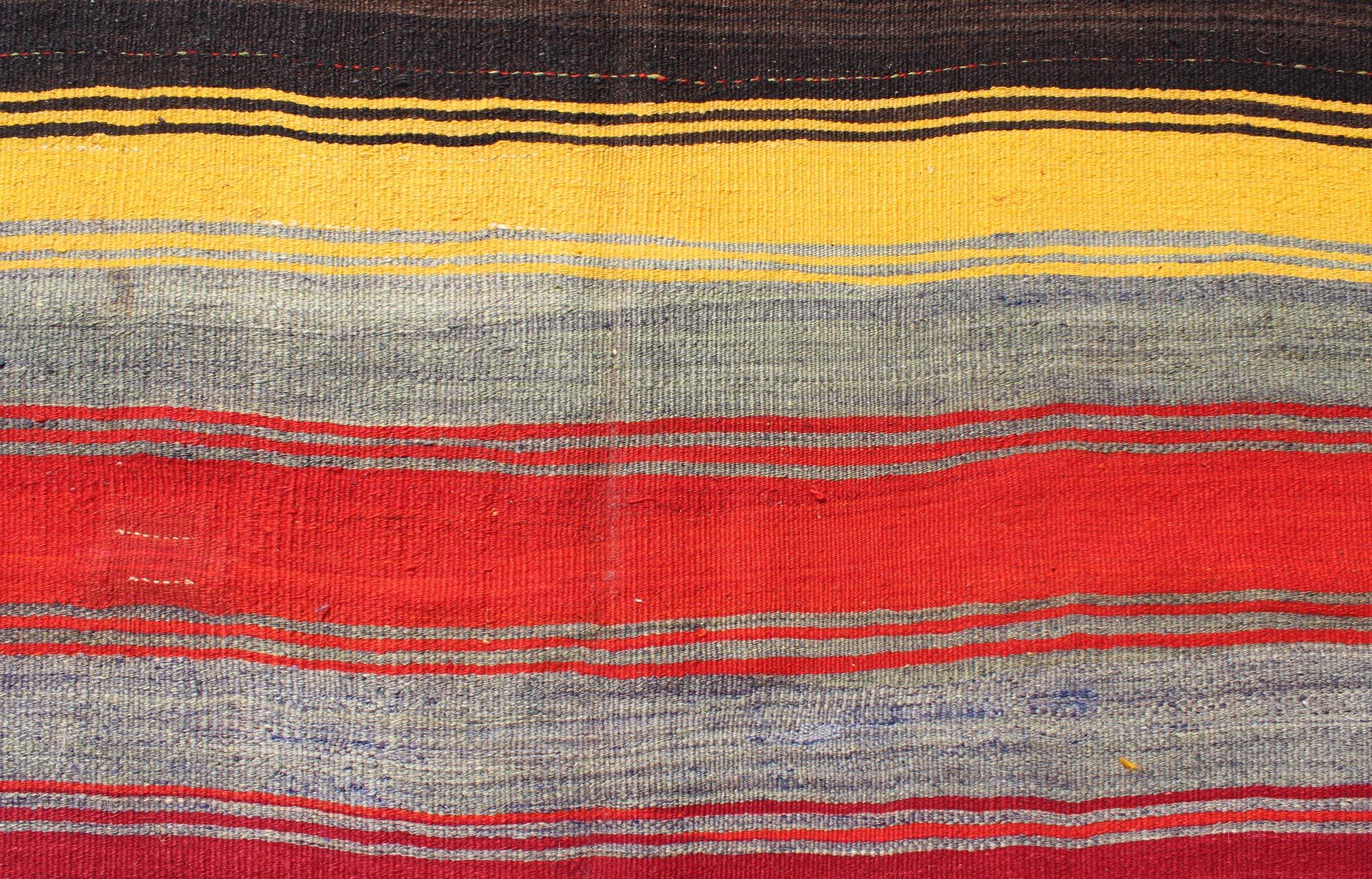 Wool Colorful Vintage Turkish Kilim Rug with Subtle Tribal Shapes and Stripes Design For Sale