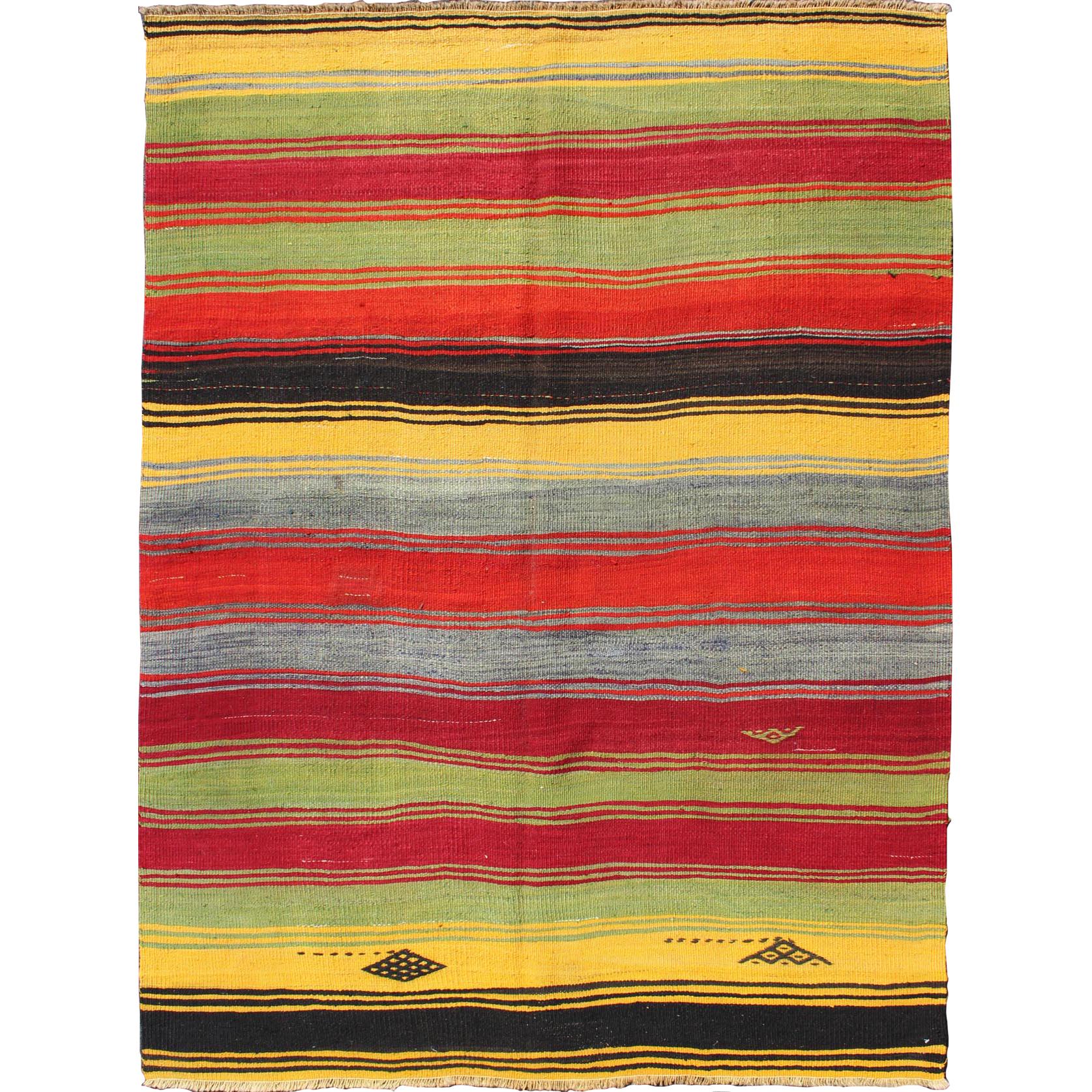 Colorful Vintage Turkish Kilim Rug with Subtle Tribal Shapes and Stripes Design For Sale