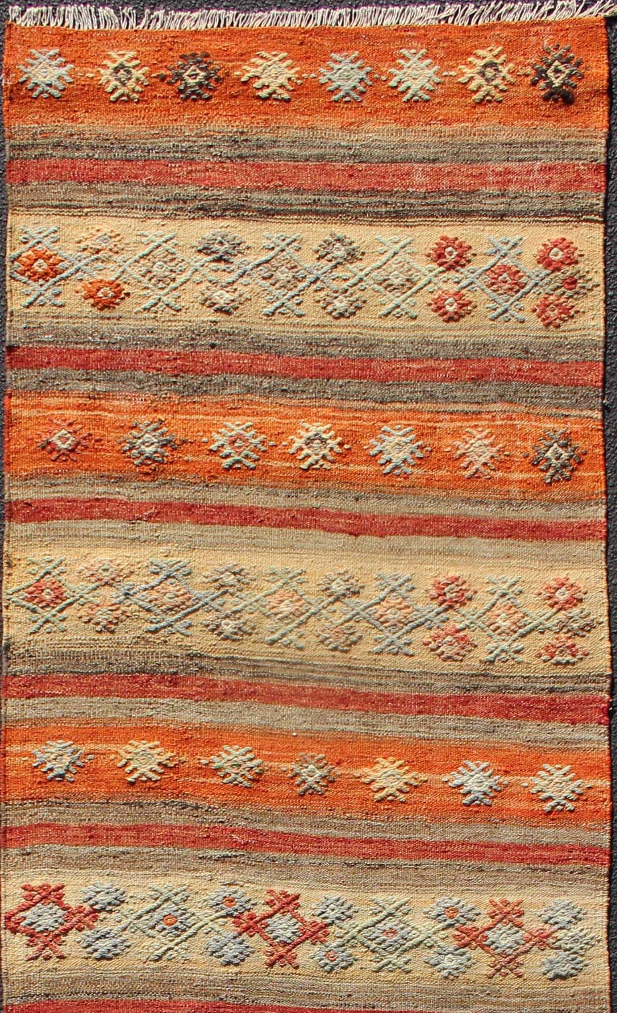 Vintage Turkish Kilim runner with horizontal stripes and scattered geometric shapes in embroideries, rug ned-124, country of origin / type: Turkey / Kilim, circa mid-20th century

Featuring geometric shapes rendered in a repeating horizontal