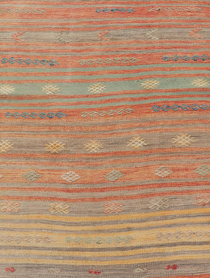Colorful vintage Turkish Kilim Runner with stripes and Geometric Embroideries. Keivan Woven Arts / rug EN-P13659, country of origin / type: Turkey / Kilim, circa Mid-20th century.

Featuring geometric shapes rendered in a repeating horizontal