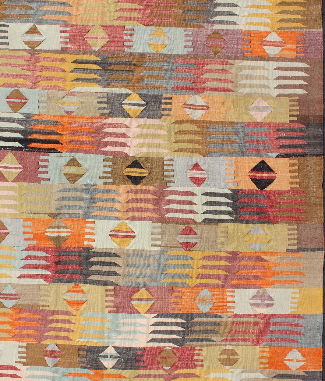 Vintage Turkish Kilim rug with all-over geometric shapes, rug TU-NED-29, country of origin / type: Turkey / Kilim, circa mid-20th century

This gorgeous and unique midcentury Turkish vintage Kilim showcases an array of beautiful colors, including