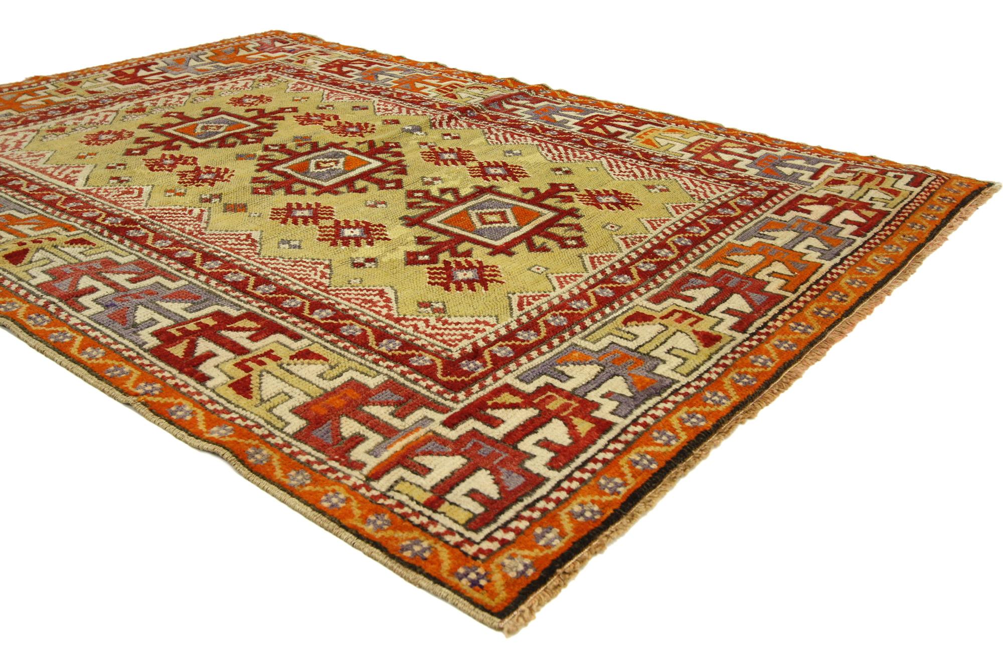 73873 Colorful Vintage Turkish Oushak Rug, 03'07 X 04'11. Step into a realm where wanderlust meets functionality, embodied in the captivating allure of this boho chic vintage Turkish Oushak rug. Picture a yellow-green field adorned with three