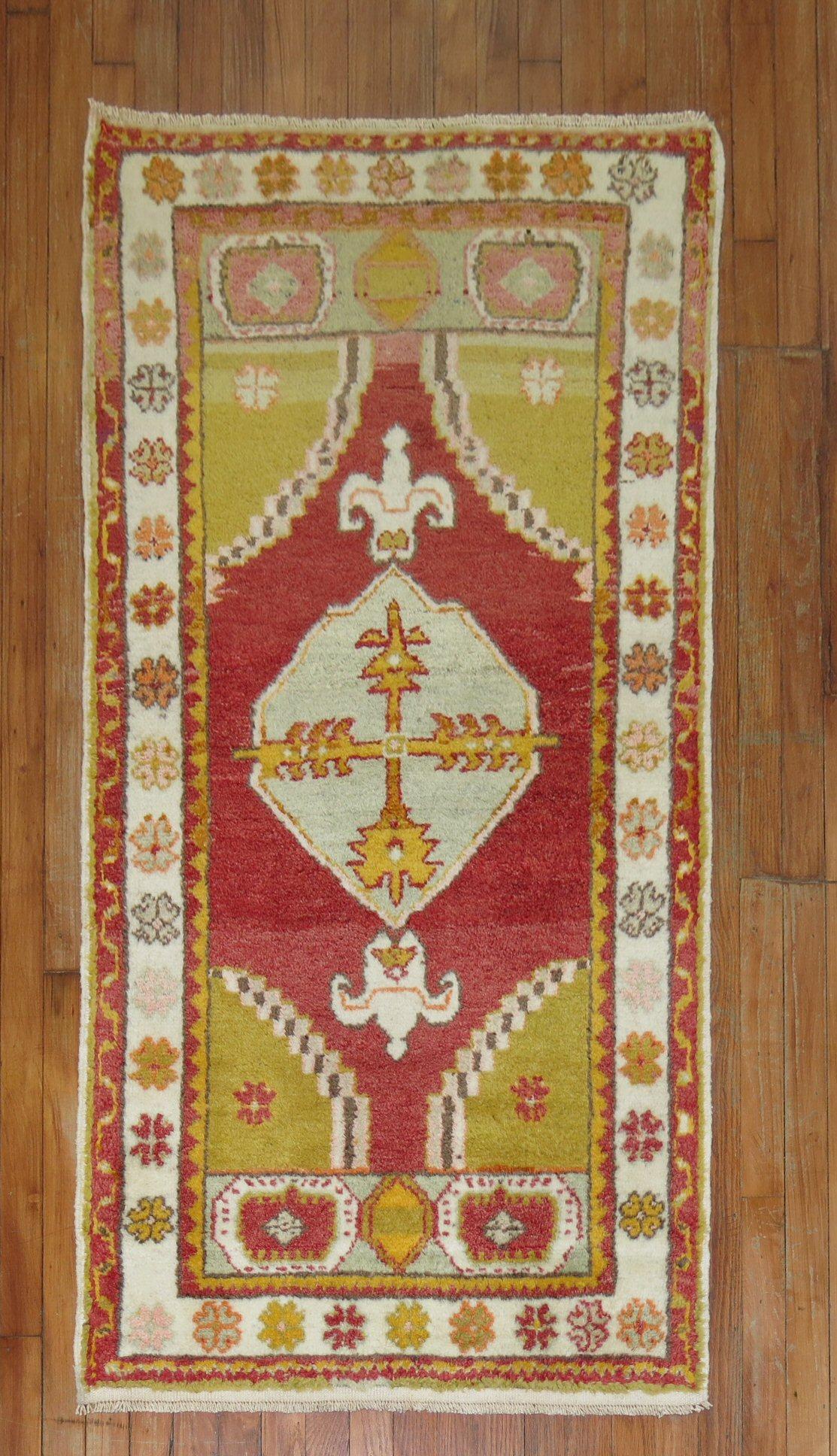 A colorful Mid-20th Century Turkish rug

Measures: 3'9'' x 5'.