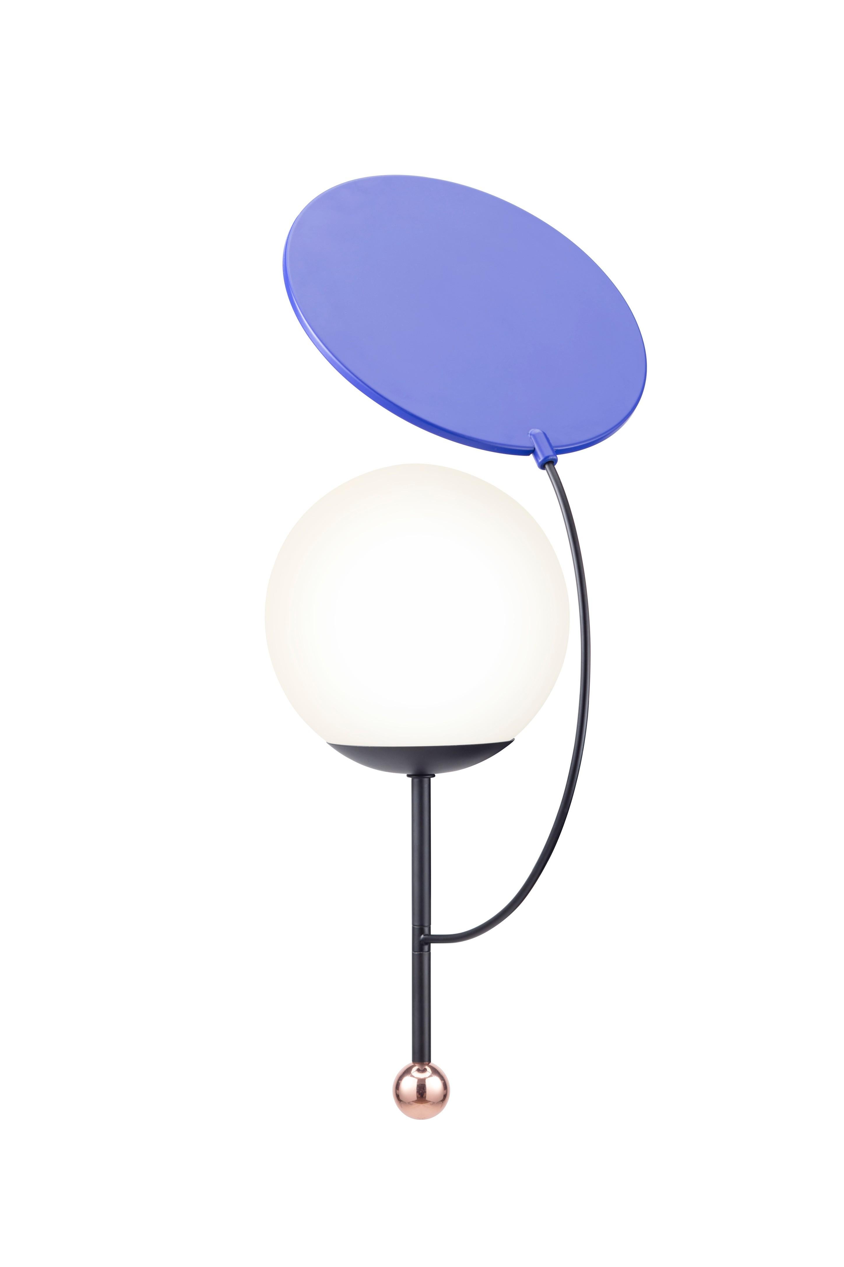 Colorful wall lamp by Thomas Dariel, Maison Dada
Measures: Diameter 24 x height 57.2 cm
Base and arm – Black powder coated metal with matte finish
Plated metal ball coated with glossy copper finish
Rotating top – Blue powder coated metal /