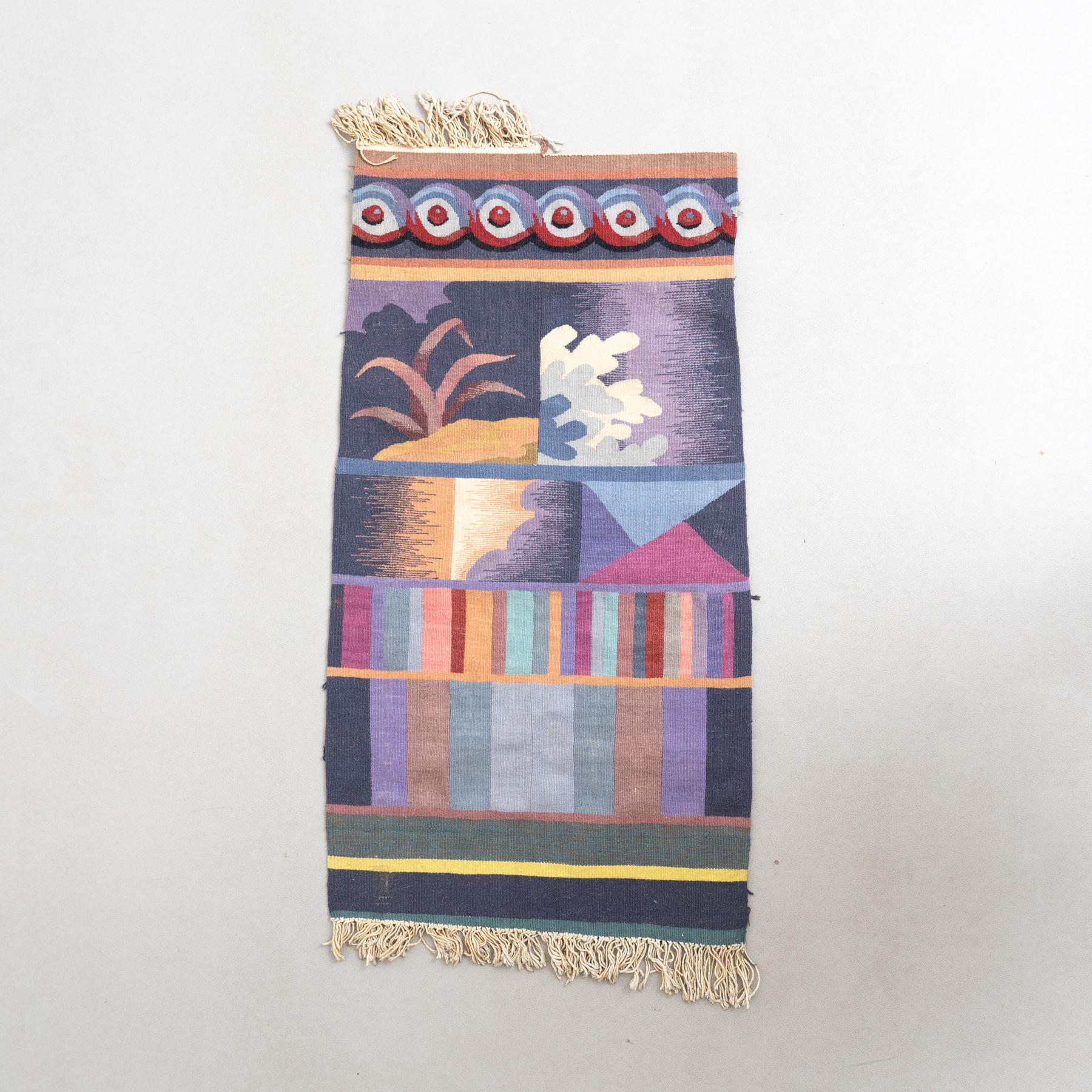 Colorful Wall Tapestry – Geometric Composition from the 70s

This vibrant wall tapestry, created in France around 1970 by an unknown artist, is a textile work of art featuring a geometric composition in a harmonious range of colorful tones. Its