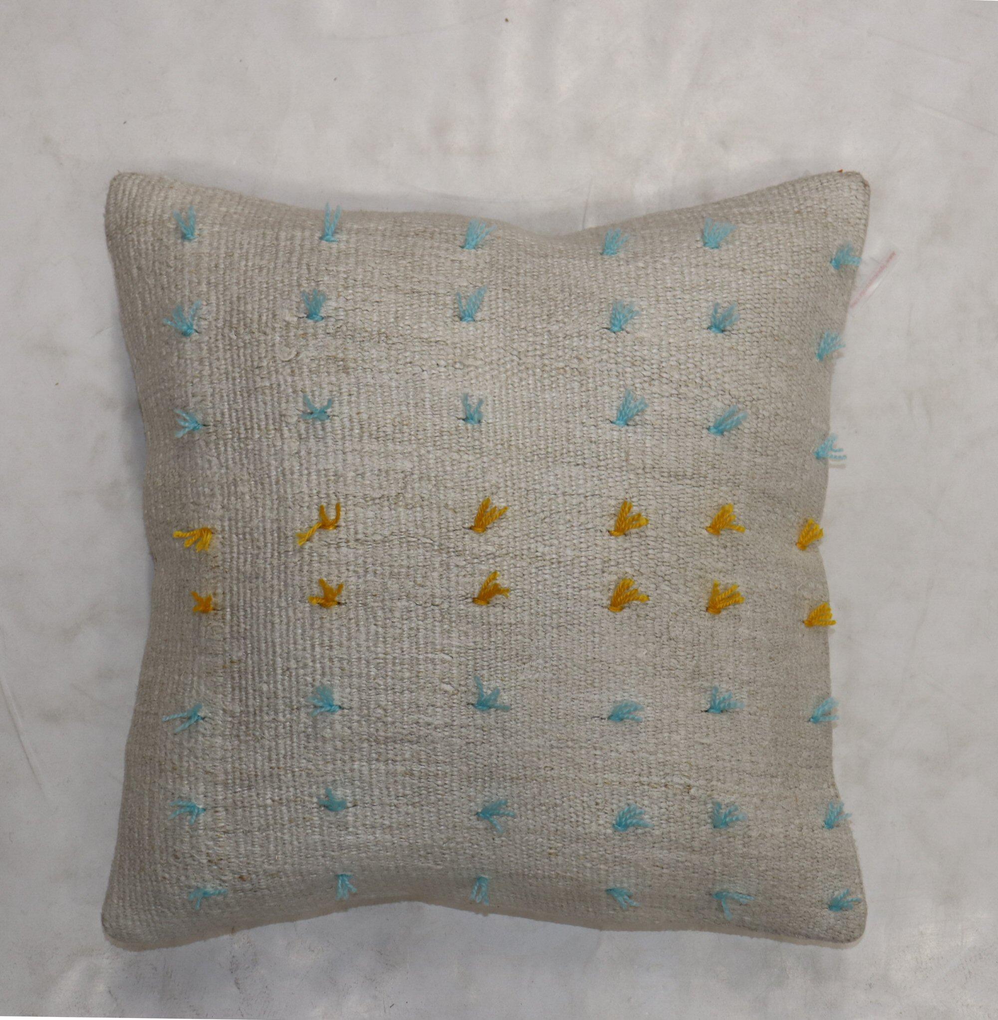 Pillow made from a vintage Turkish Kilim with yellow and blue wool stitched on giving it a bohemian vibe. Zipper closure and foam insert provided.


Measures: 20