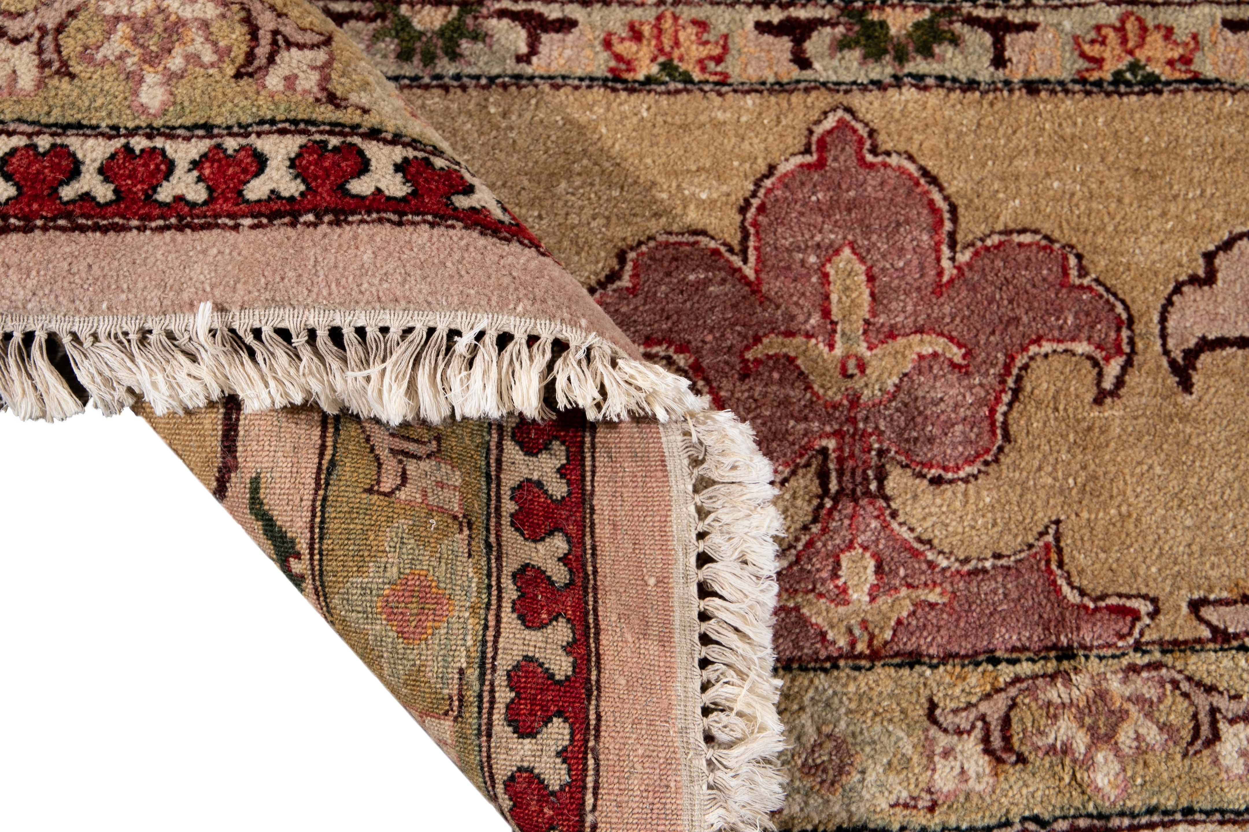 Beautiful colorful Indian Agra hand knotted wool rug with a center medallion floral design on a beige field. This rug has a multi-color accent throughout the piece.

This rug measures: 13'6
