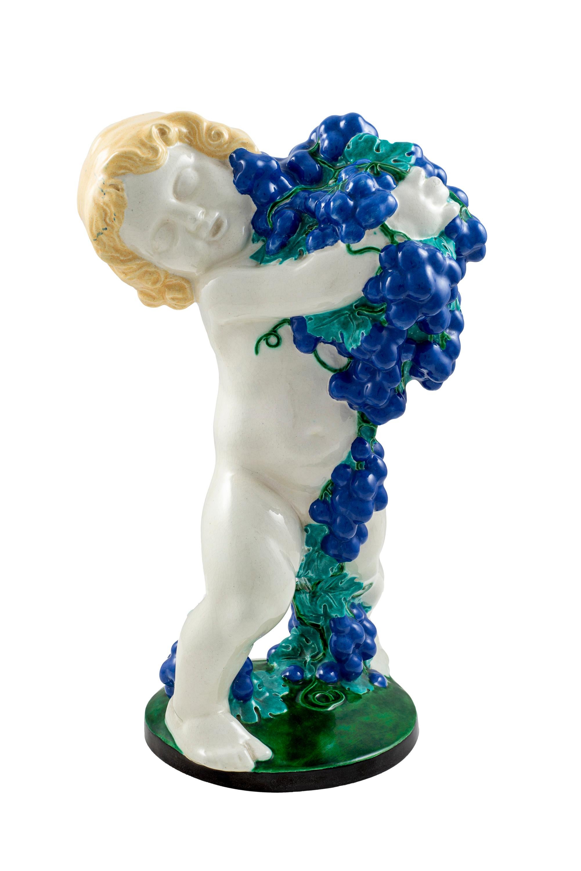 Colorfully glazed ceramics putto with grapes Michael Powolny Austrian Jugendstil circa 1907 Allegory of Autumn

Michael Powolny (Judenburg 1871-1954 Vienna) is one of the best-known ceramic artists of the Viennese Art Nouveau and popular among
