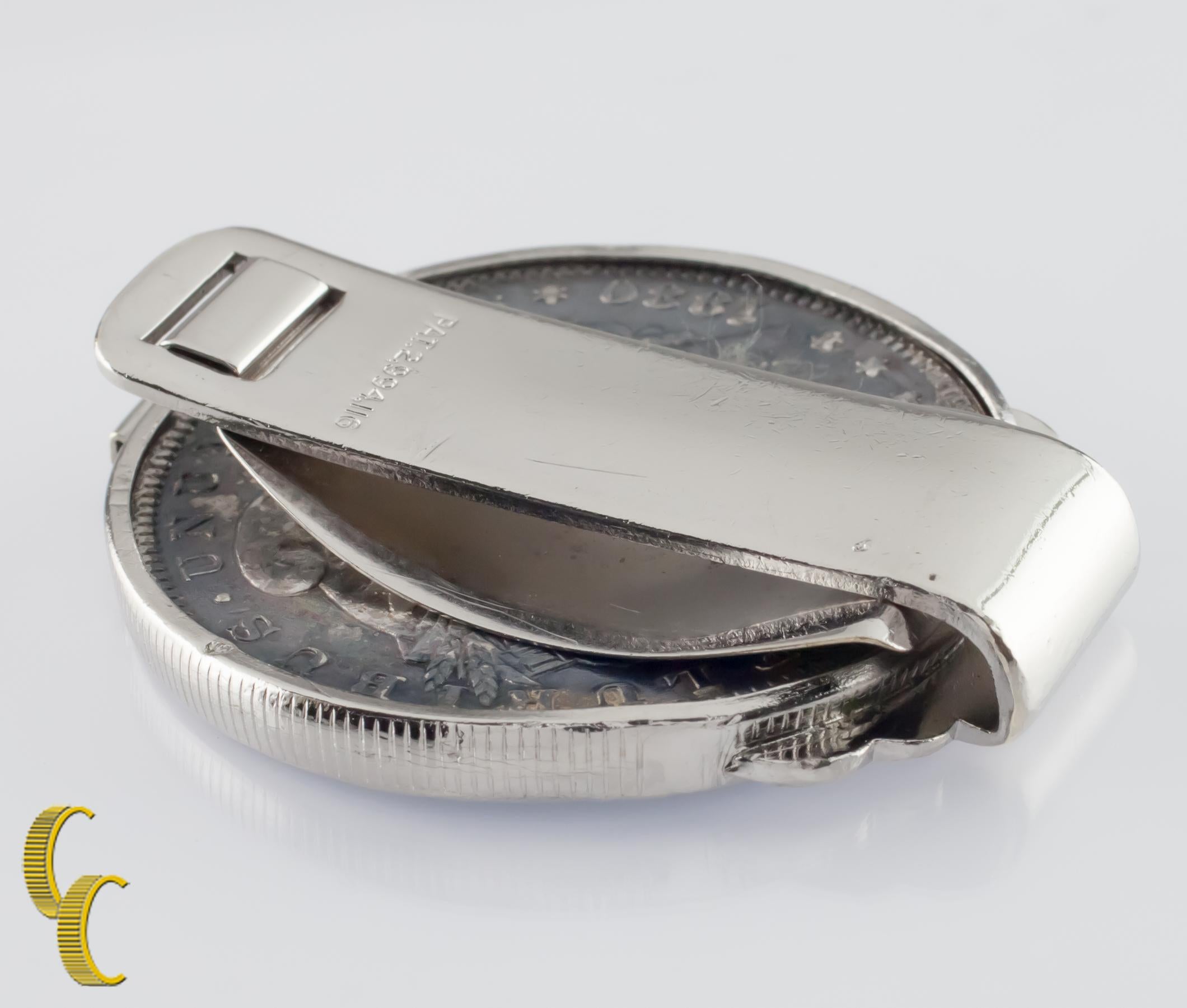 Colorized 1880 Morgan silver dollar set in a stainless steel money clip.
Morgan dollar is set in a bezel with enamel crystal.
Weight: 39.2 grams.
Length: 45 mm.
