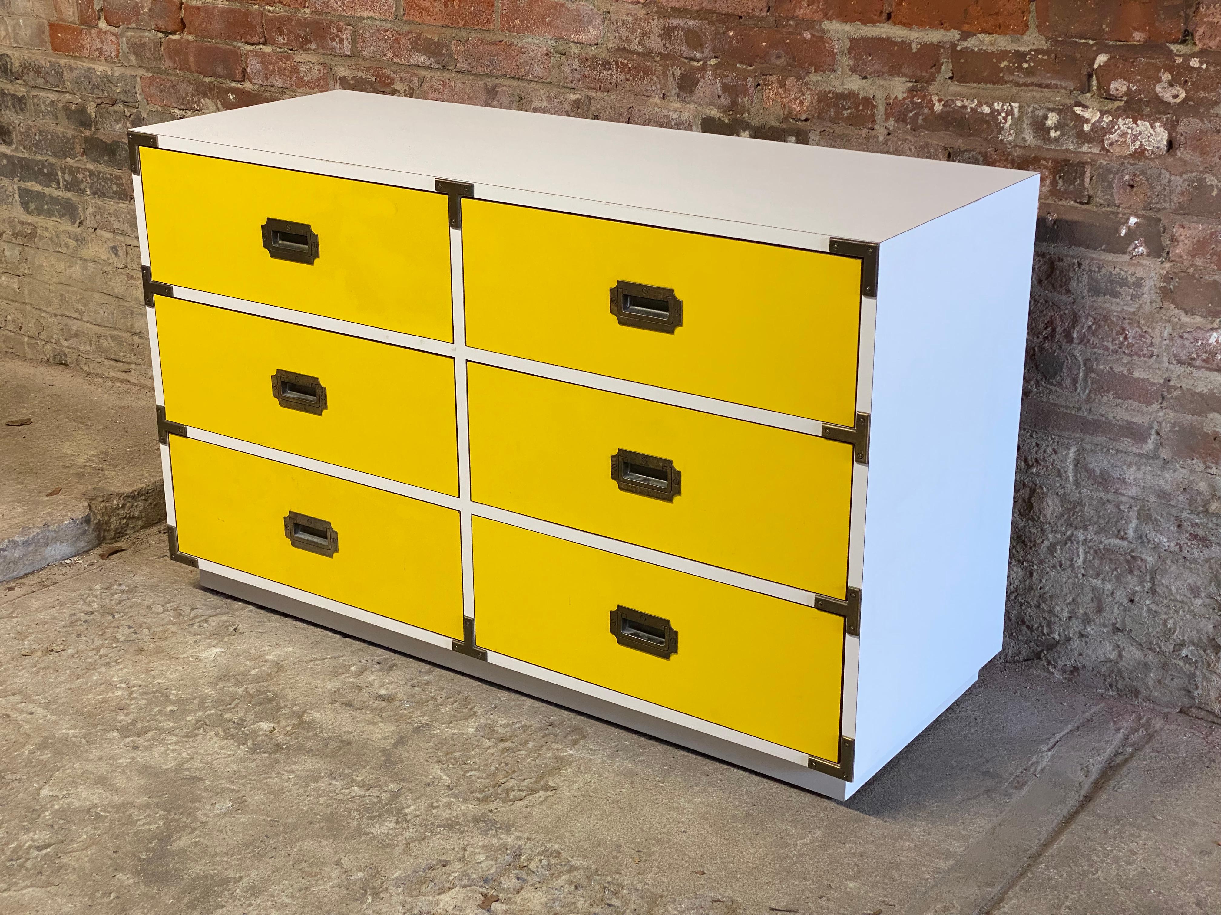 A distinct statement Colormates Campaign style dresser by Morris of California. Bright canary yellow laminate drawers with a white laminate case. Six spacious drawers with metal details. Recessed drawer hardware. Circa late 1960s-early 1970s.