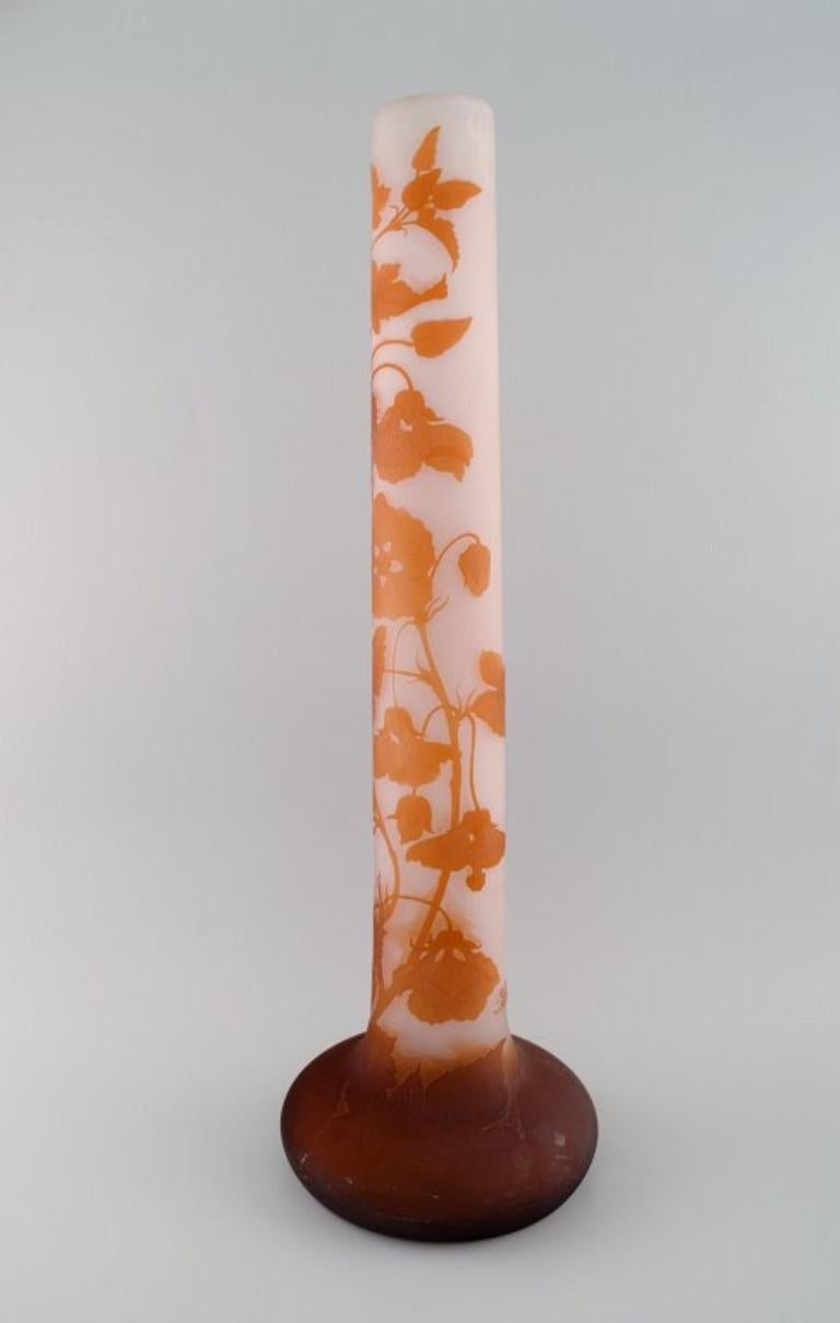 Colossal antique Emile Gallé vase in frosted and orange art glass carved in the form of flowers and foliage. 
Early 20th century. Museum quality.
Measures: 61 x 19 cm.
In excellent condition.
Signed.