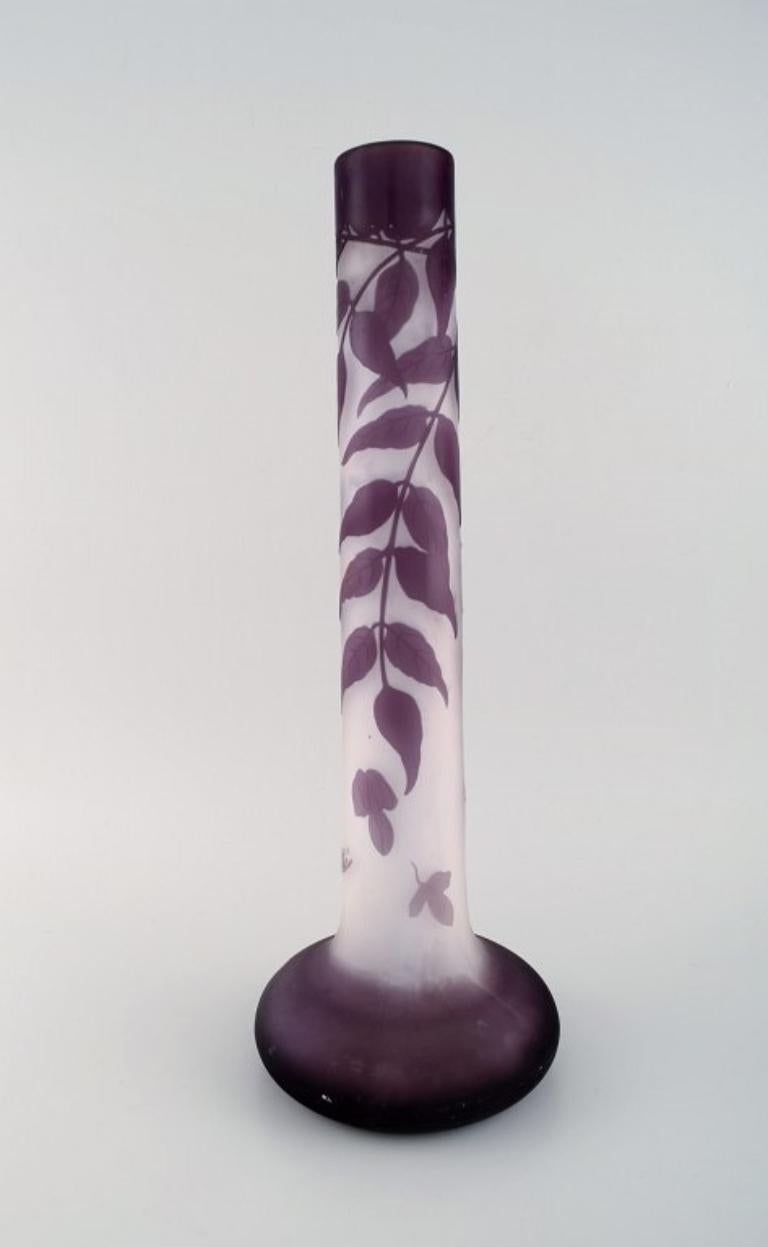 Colossal antique Emile Gallé vase in frosted and purple art glass carved in the form of foliage. 
Ca. 1920.
Measures: 43.5 x 16 cm.
In excellent condition.
Signed.