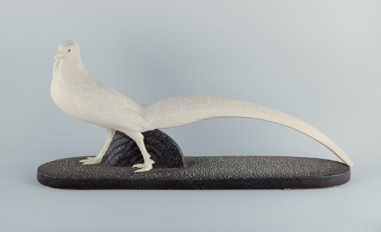 Colossal Art Deco Sèvres sculpture of a white pheasant in earthenware.
Stylish and decorative sculpture of impressive quality.
1930s.
Stamped MNF (Manufacture Nouvelle de Faïences).
In perfect condition.
Dimensions: L 69.0 x H 31.0 cm.