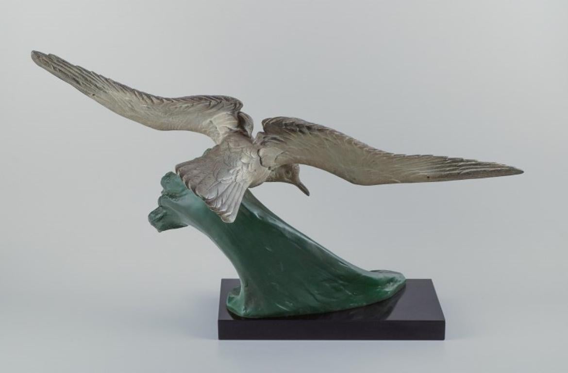 Patinated Colossal sculpture after Henry Lechesne. Bird with outstretched wings For Sale