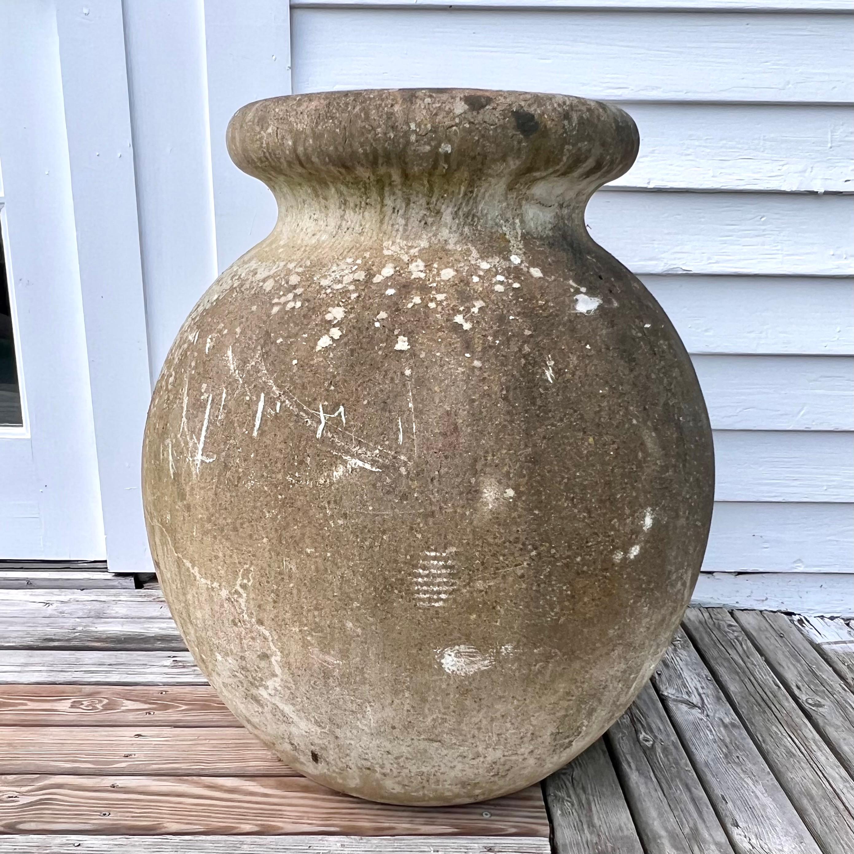 Oversized concrete olive jar planter by Willy Guhl with great patina and prominent presence. Simple and elegant design perfect for any garden or patio. Excellent patina and vintage condition. Multiple available in this size with varying degrees of