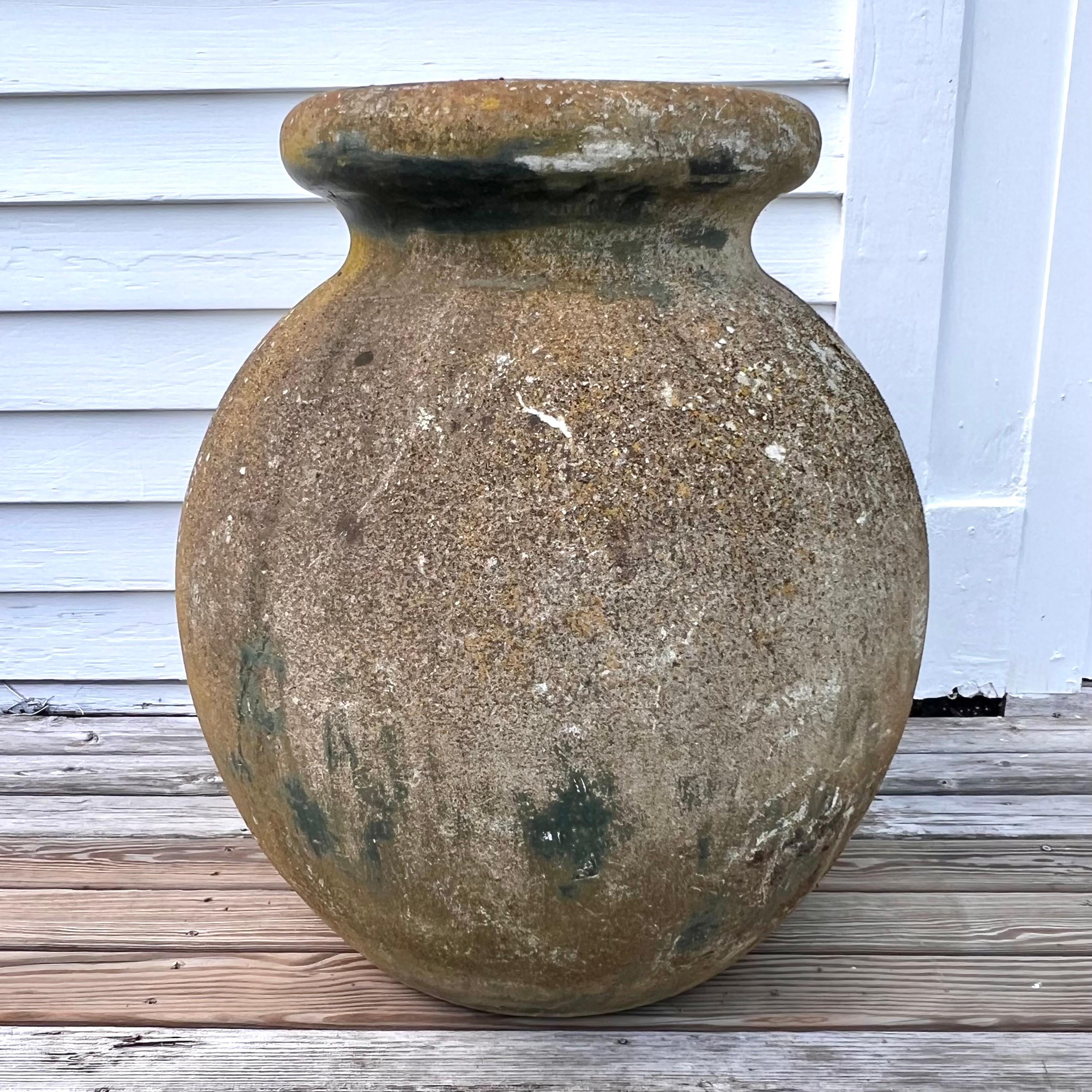Oversized concrete olive jar planter by Willy Guhl with great patina and prominent presence. Simple and elegant design perfect for any garden or patio. Gorgeous patina and wonderful earthy green and blue hues. Excellent vintage condition. Multiple