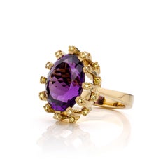 Colosseum: 18kt Yellow gold cocktail ring with bright amethist and green diamond