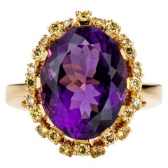 Colosseum: 18kt Yellow gold cocktail ring with bright amethist and green diamond