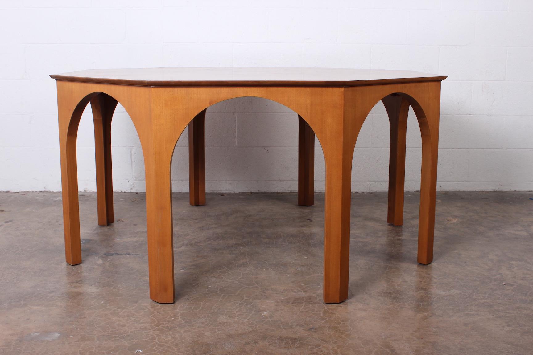 A rare Colosseum dining table in bleached walnut designed by T.H. Robsjohn-Gibbings for Widdicomb.