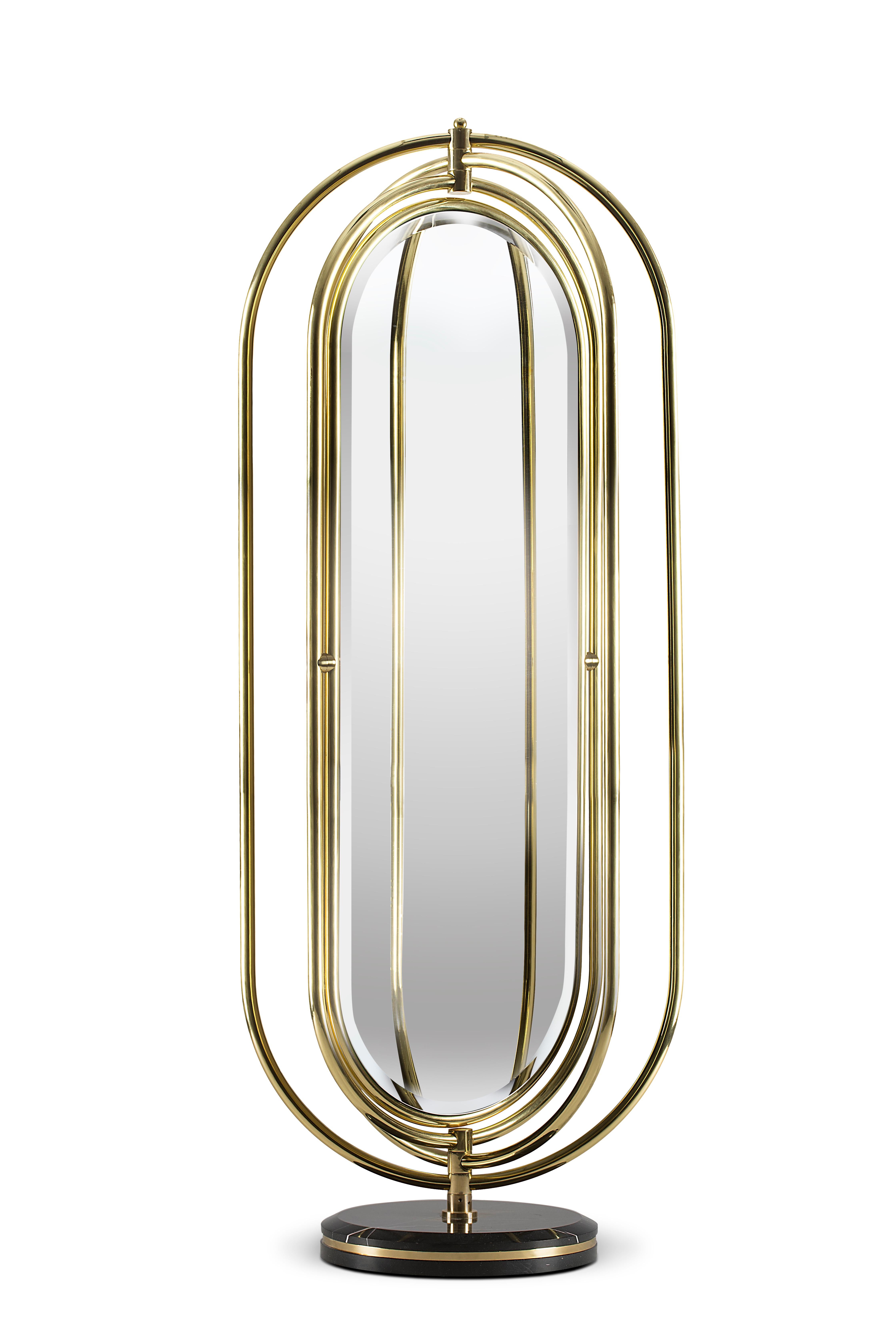 Colosseum is a full length floor mirror supported by a Nero marquina marble base accented by a brass trim around it. The frame structure is built in polished brass tubes, assembled to produce an oblong shape. The rings rotate 360 degrees, making