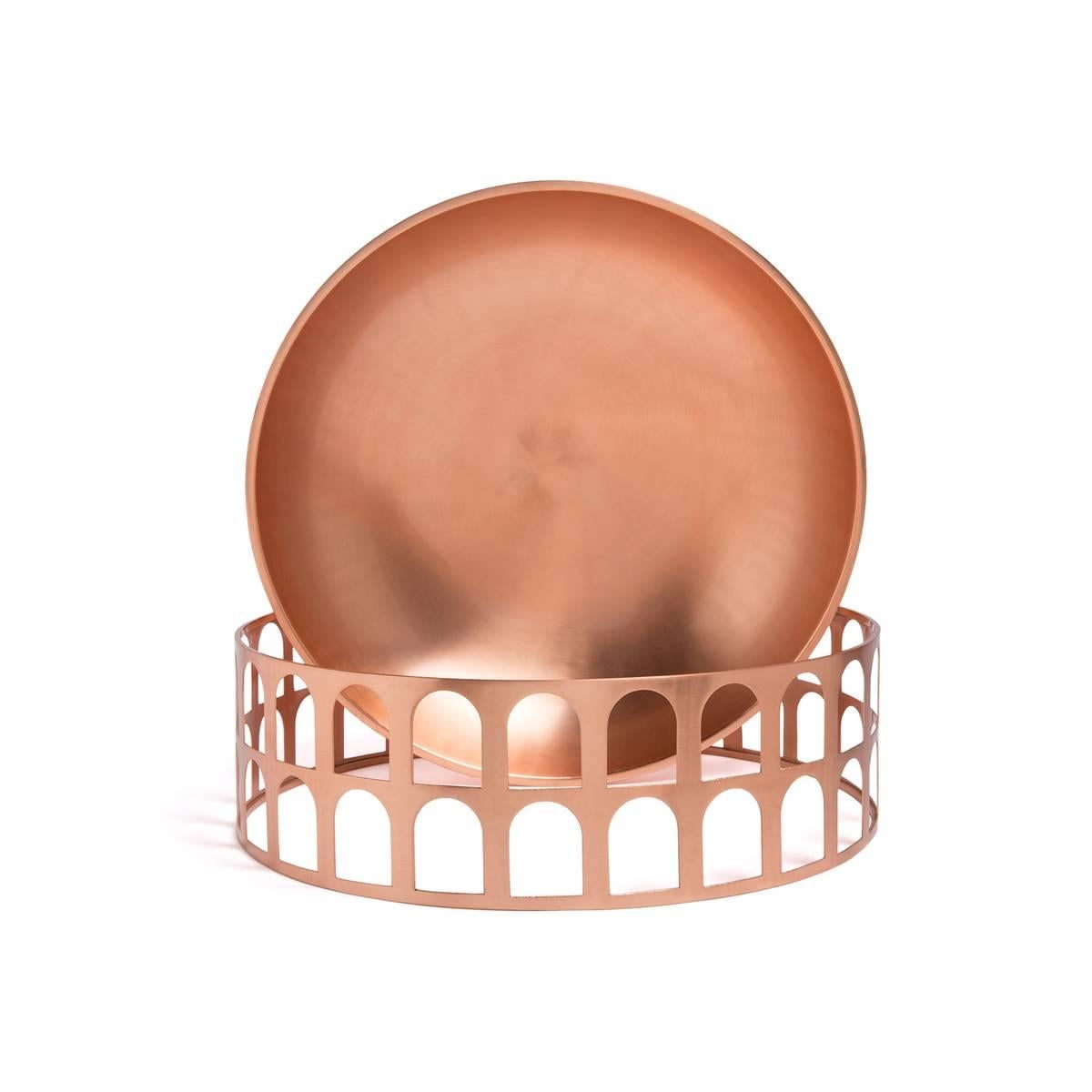 Colosseum I is a copper centerpiece (or fruit bowl). 
The product is part of the collection New Roman, by Jaime Hayon, a series of containers which reference the shapes of ancient carafes, plates and the large storage vessels amphorae. Inspired by