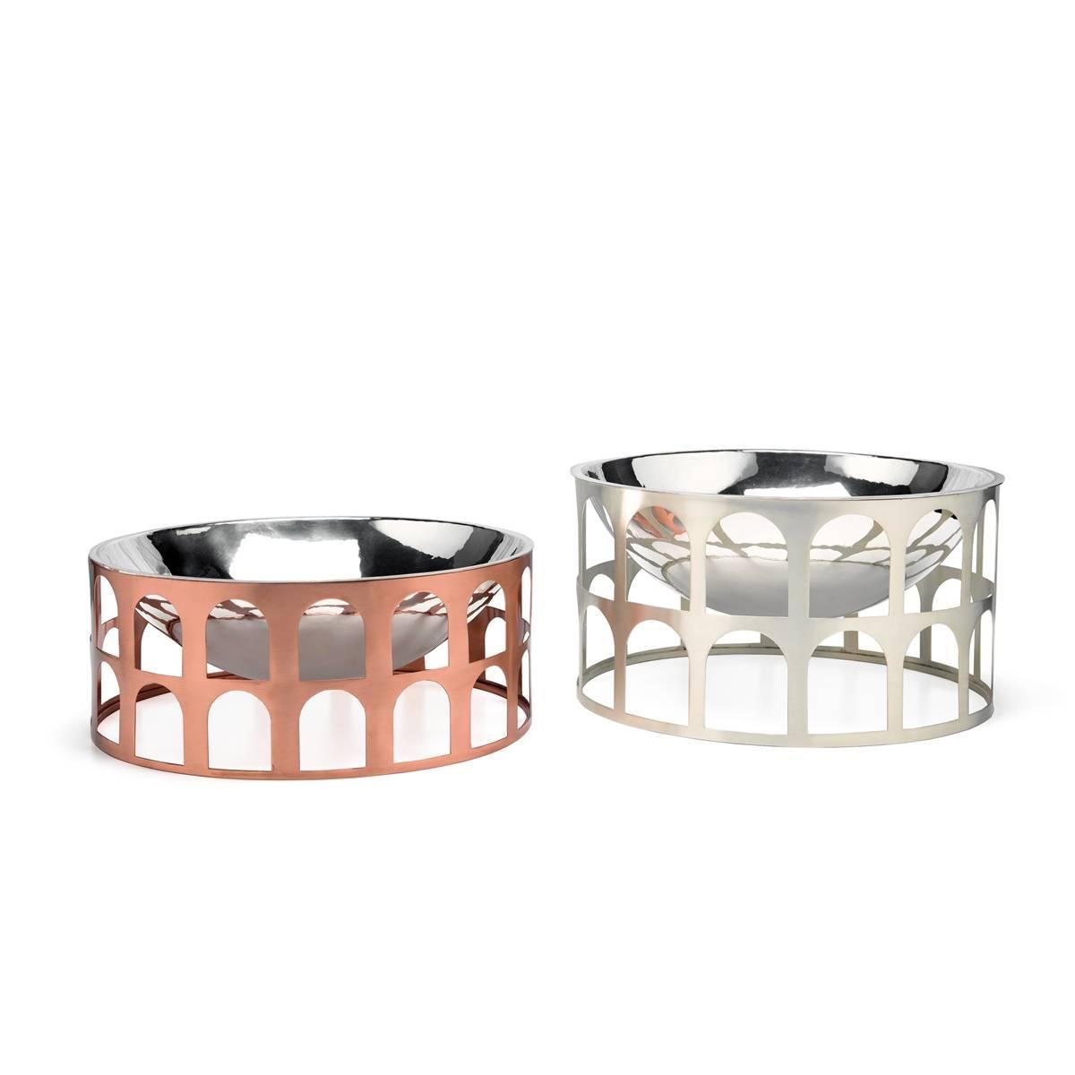 Colosseum III is a silver pleated metal centerpiece with copper base, it could be used also as fruit bowl
The product is part of the collection New Roman, by Jaime Hayon: inspired by the vessels of the Roman Empire, this collection transforms