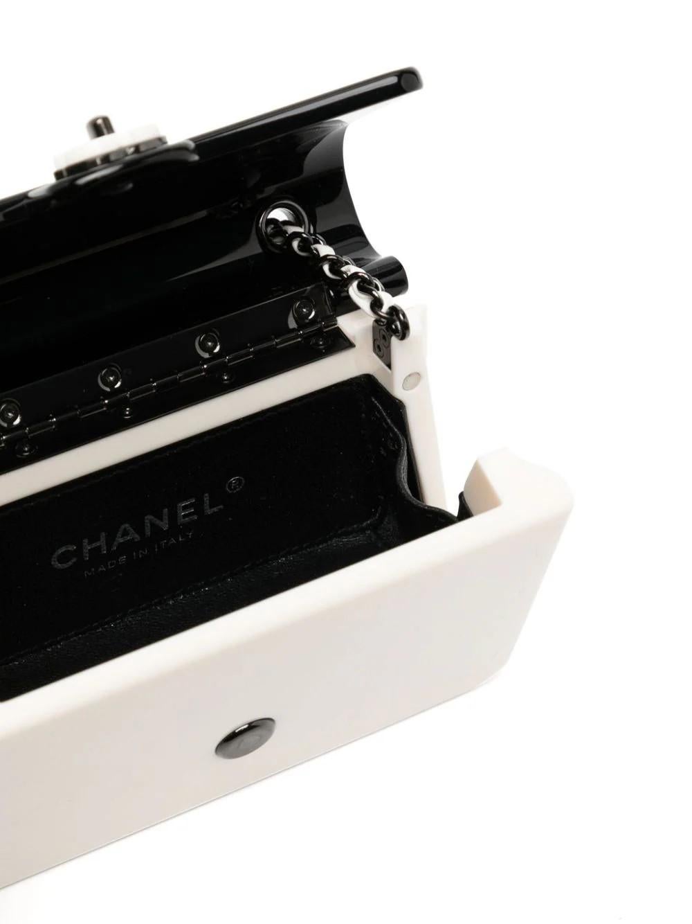 This white colour-block flap bag from Chanel is a hard-to-find piece that is sure to make a statement. Made from top-quality PVC material, this bag is both stylish and durable. Its clean white colour means it will match any outfit, making it a