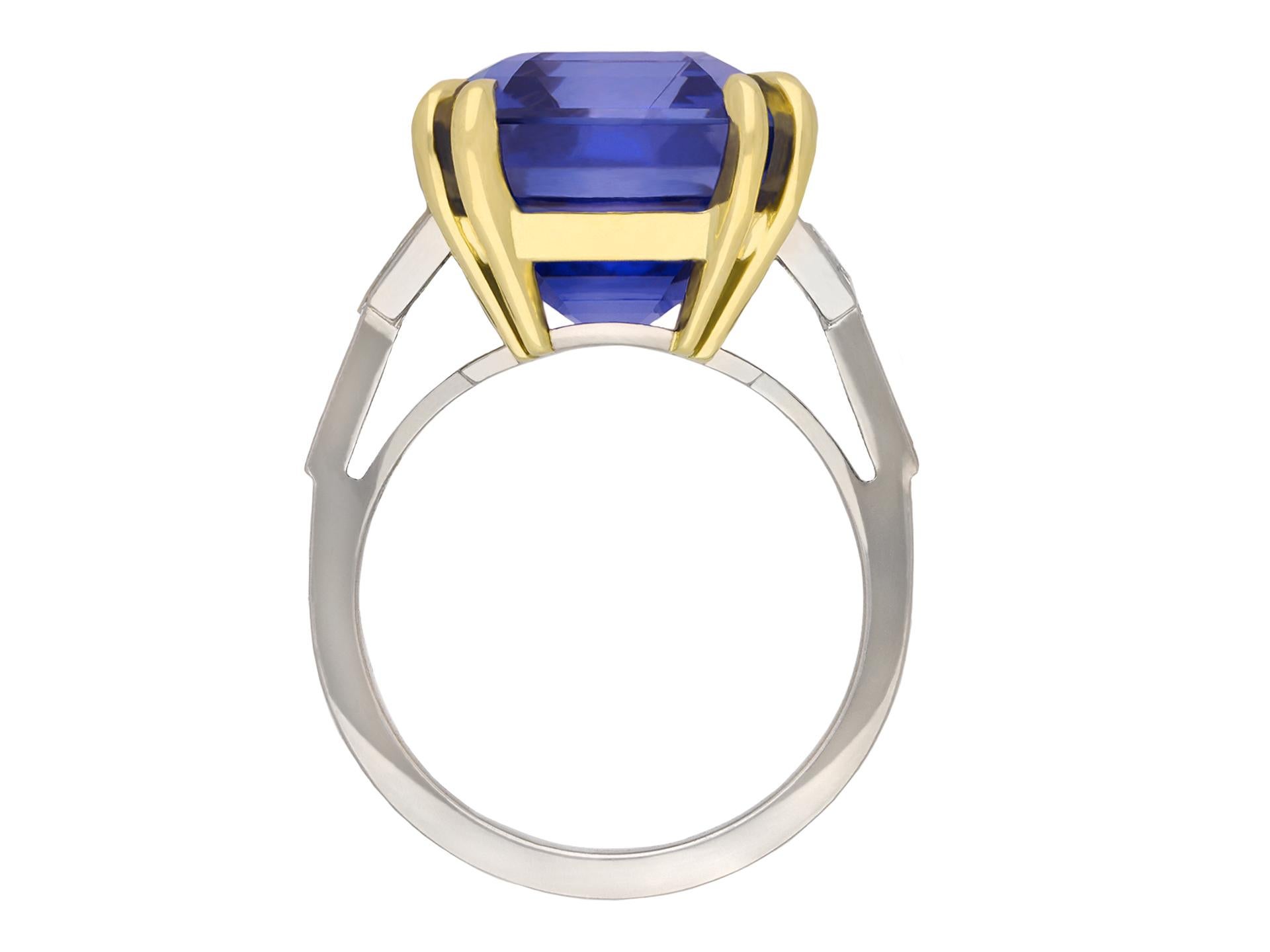 Colour change Ceylon sapphire and diamond coronet cluster ring. Centrally set with a octagonal step cut natural unenhanced blue/purple colour change Ceylon sapphire, blue in daylight, purple in incandescent light, in an open back claw setting with a